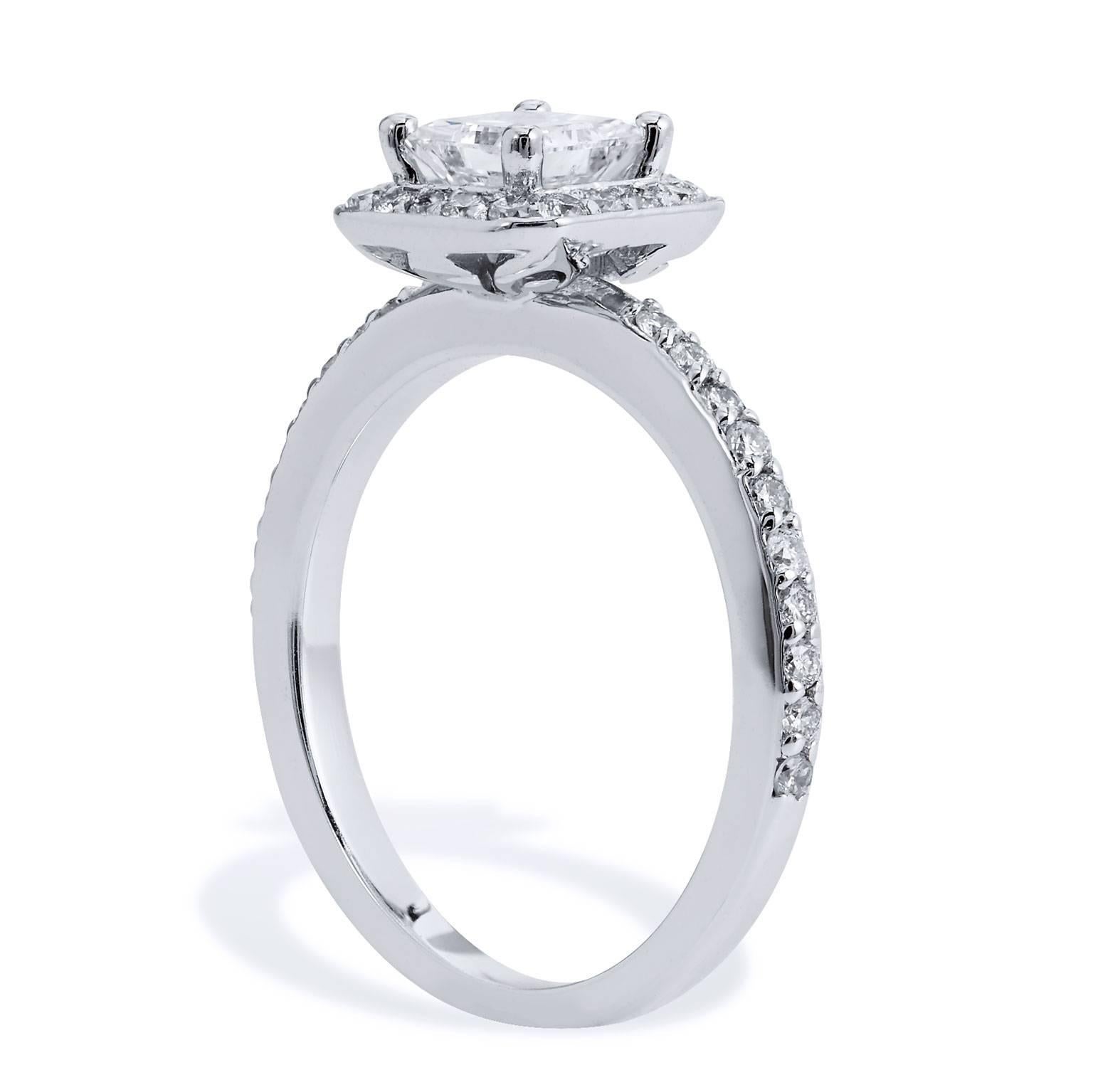 Create a shimmer and shine that she will adore with this 14 karat white gold engagement ring. Twenty-five pieces of pave set diamonds, with a total weight of 0.28 carat, embellish the halo and down the shank. A dazzling 0.54 carat princess cut