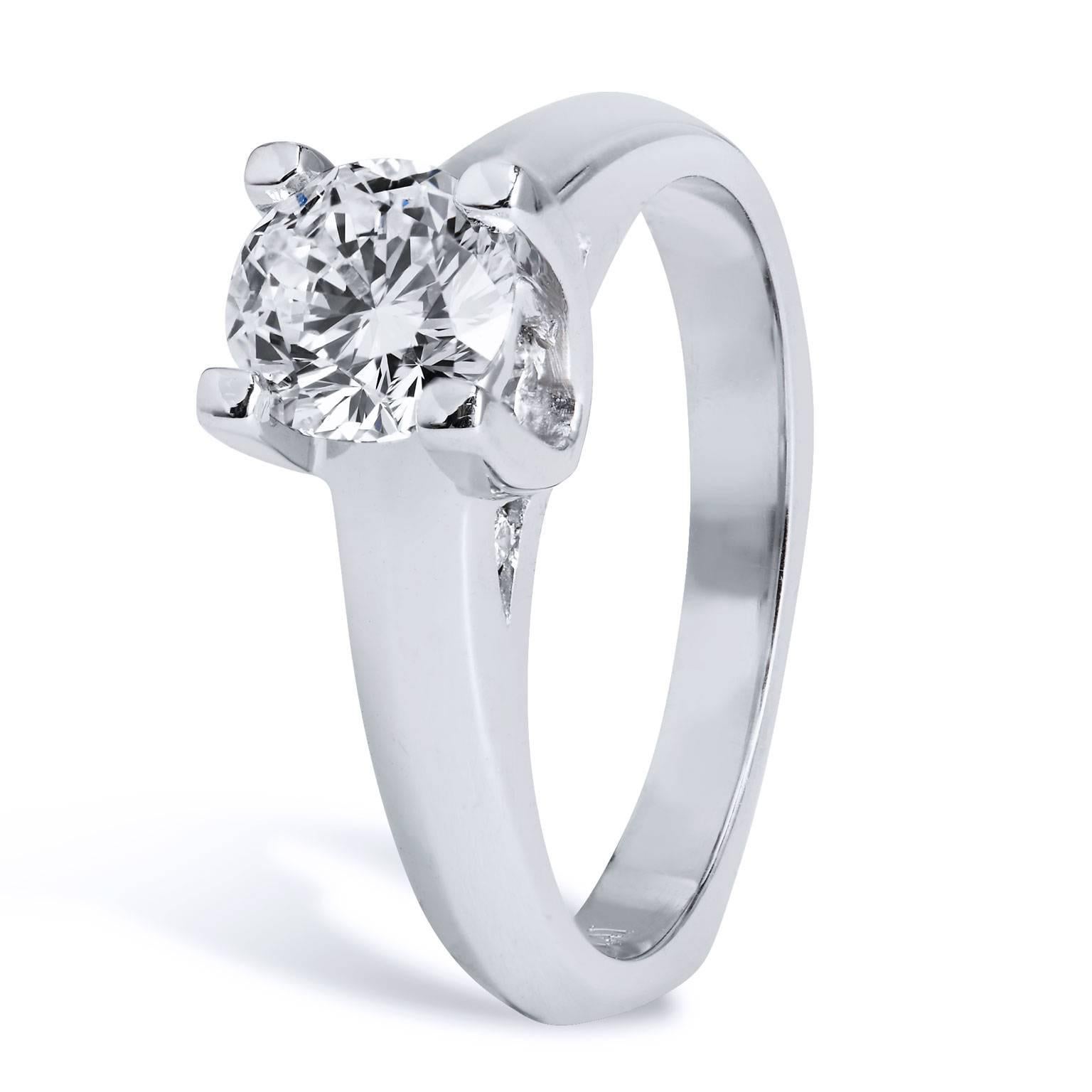 Breathtaking natural beauty defines this gorgeous engagement ring with its timeless design and its quality grade color and clarity. This previously loved diamond solitaire engagement ring features a 0.98 carat GIA certified round brilliant cut
