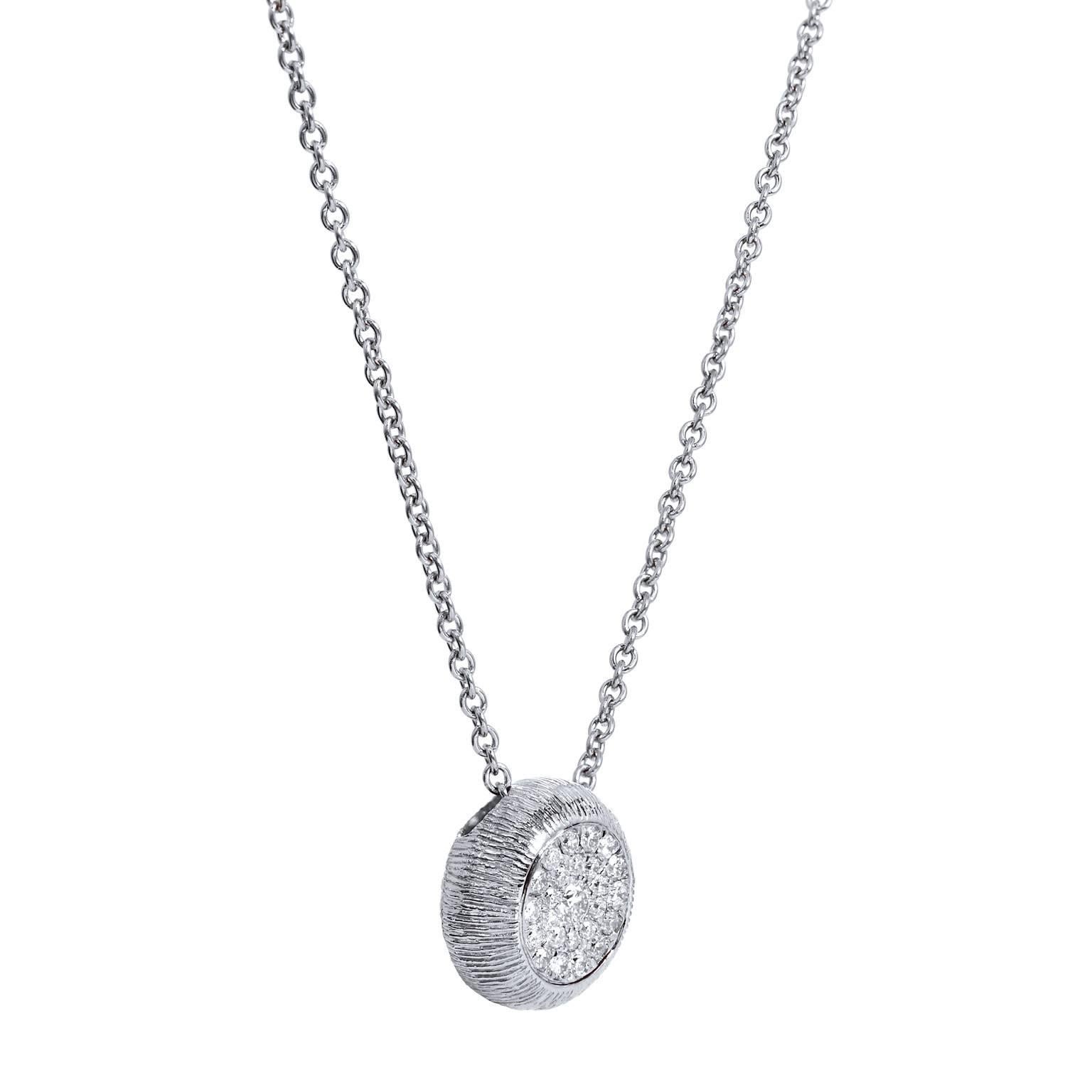 Twenty-five pave-set diamonds, with a total weight of 0.25 carat (G/H/VS), are bezel set in 18 karat white gold and features a textured appearance in this drop pendant necklace.

The pendant measures 11 mm in diameter.  
The necklace measures 18