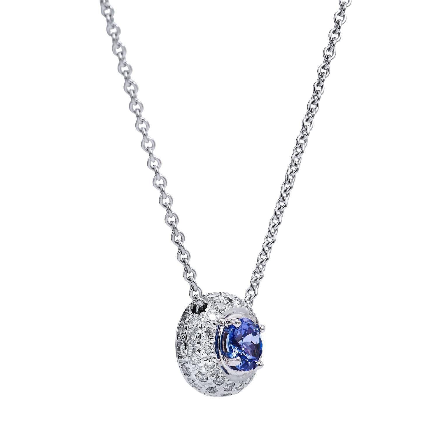 Tanzanite, a gemstone that is likened to that of sapphire, blue topaz, and aquamarine with its stunning hues of blue. Enjoy this previously loved 14 karat white gold pendant featuring a 0.75 carat violet-blue tanzanite bezel set at center