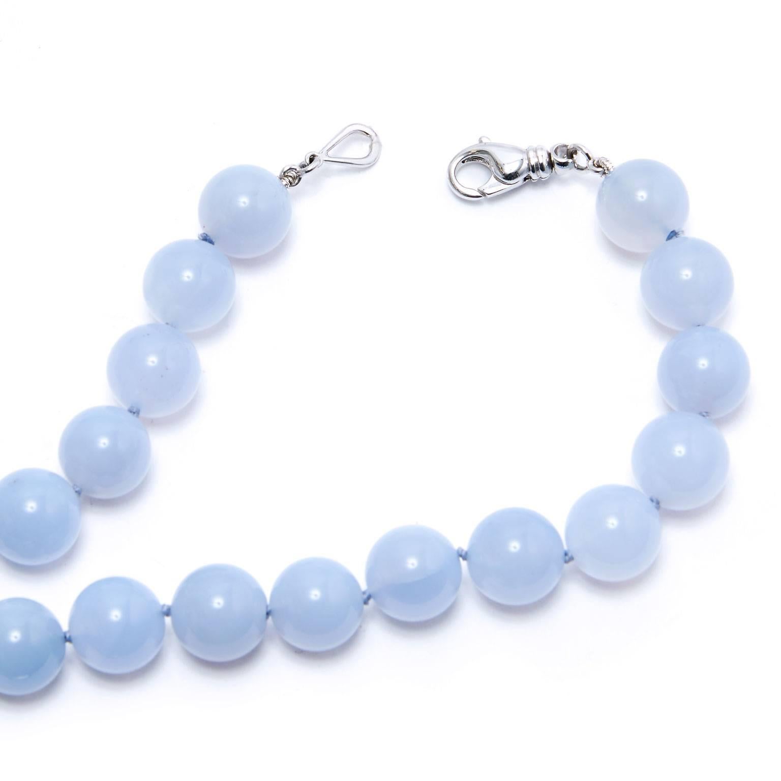 Misty chalcedony with its cool and serene appearance come together as 14 millimeter beads in this charming, handmade H and H beaded necklace featuring an 18 karat white gold lobster clasp.
