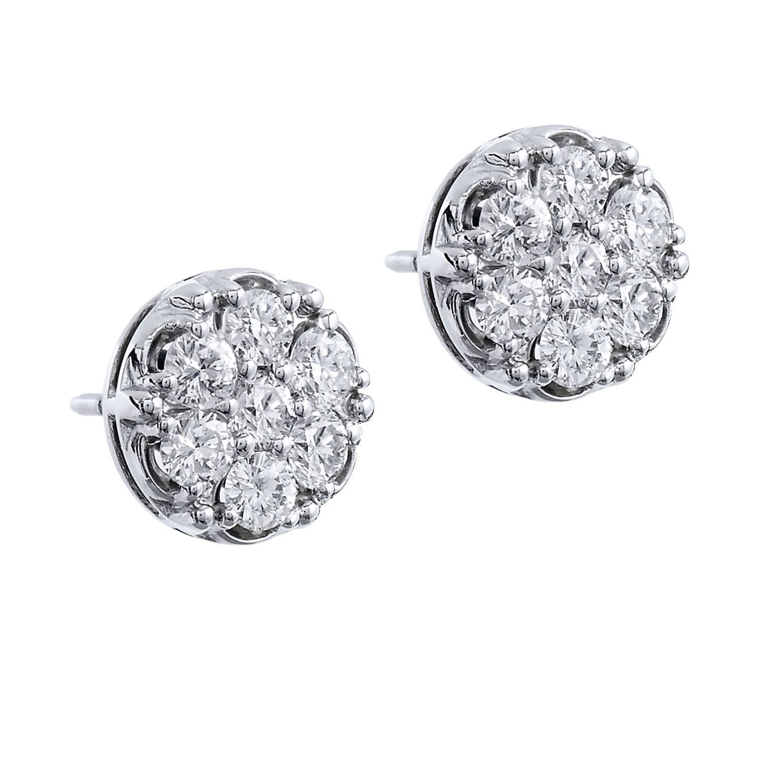 Enjoy these previously loved 14 karat white gold stud earrings featuring 1.65 carat of pave set diamond in circular orientation (F/G/SI1).