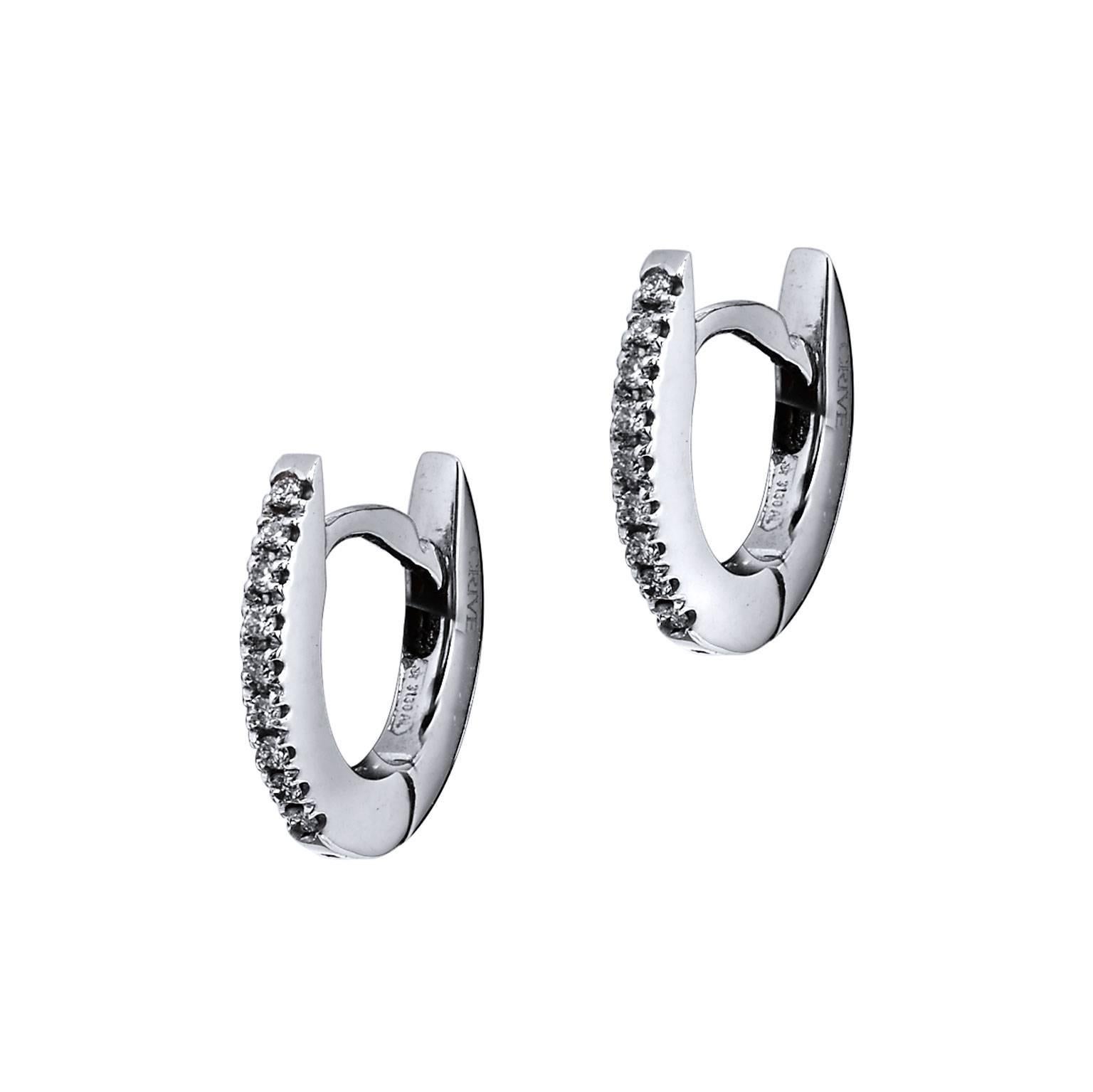 Enjoy these 18 karat white gold small diamond hoop earrings that are the next casual and chic addition needed in one's wardrobe. With 0.07 carat of diamond in color G and clarity SI, these darling hoops are sweet and swank. 