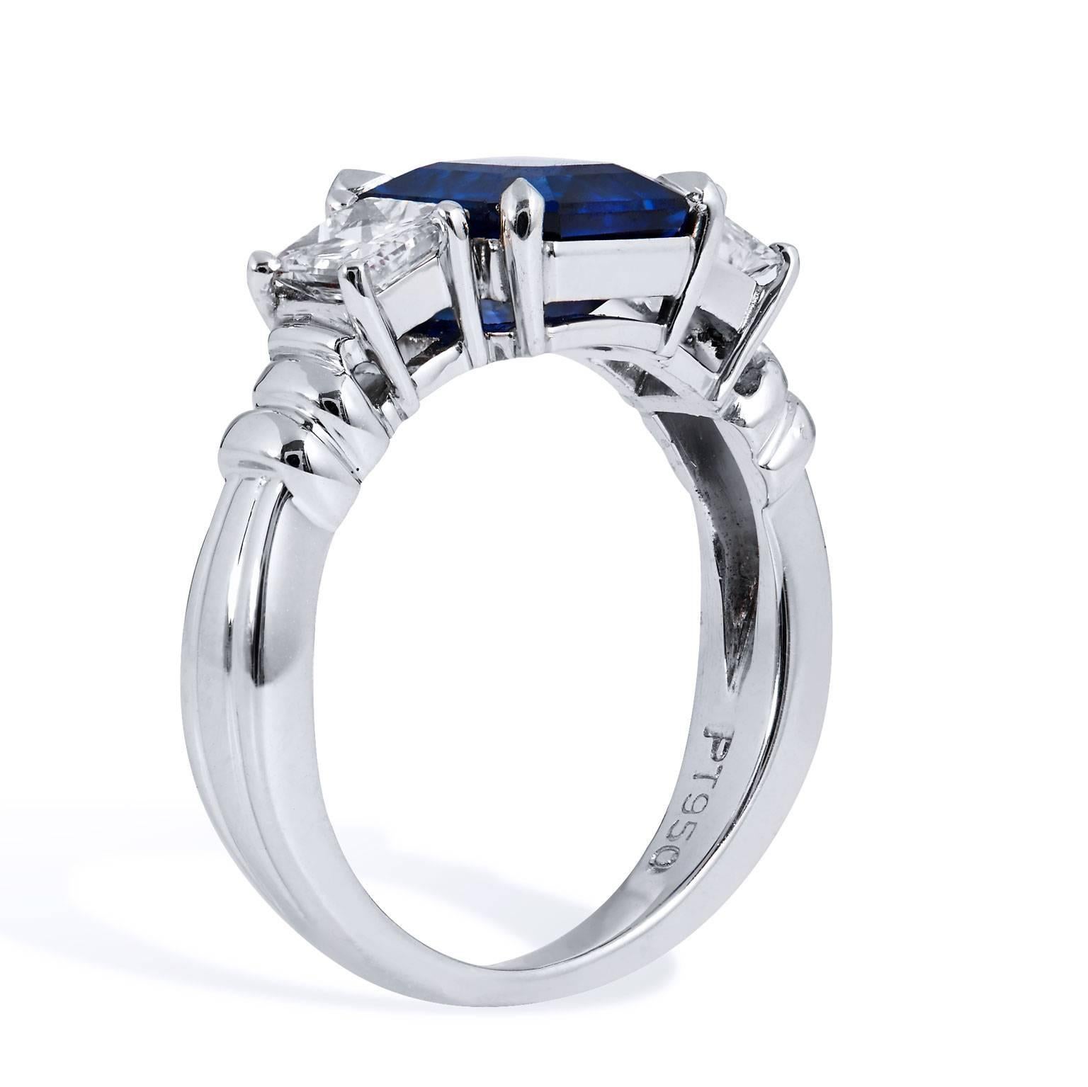An embellished yet minimal design, this spectacular platinum ring features a 2.57 carat emerald cut blue sapphire (GIA #6173349880) affixed at center while 0.78 carat of diamond side stones (I/J/VS) enhance the four-prong blue sapphire- sweet and