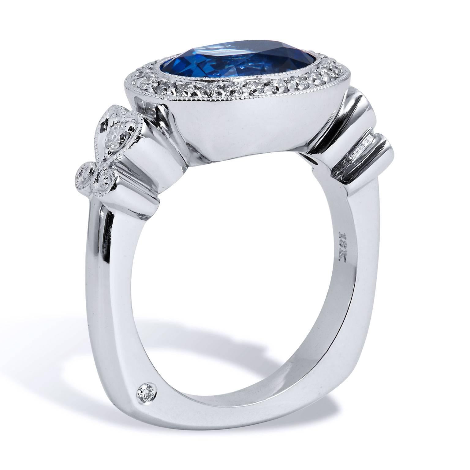 H & H 4.18 Carat Oval Sapphire and Diamond Pave Ring

This is a stunning handmade, one of a kind blue sapphire and diamond ring.  
It is made of 18 karat white gold and palladium. 

The blue sapphire center is a 4.18 carat oval cut sapphire ( GIA#