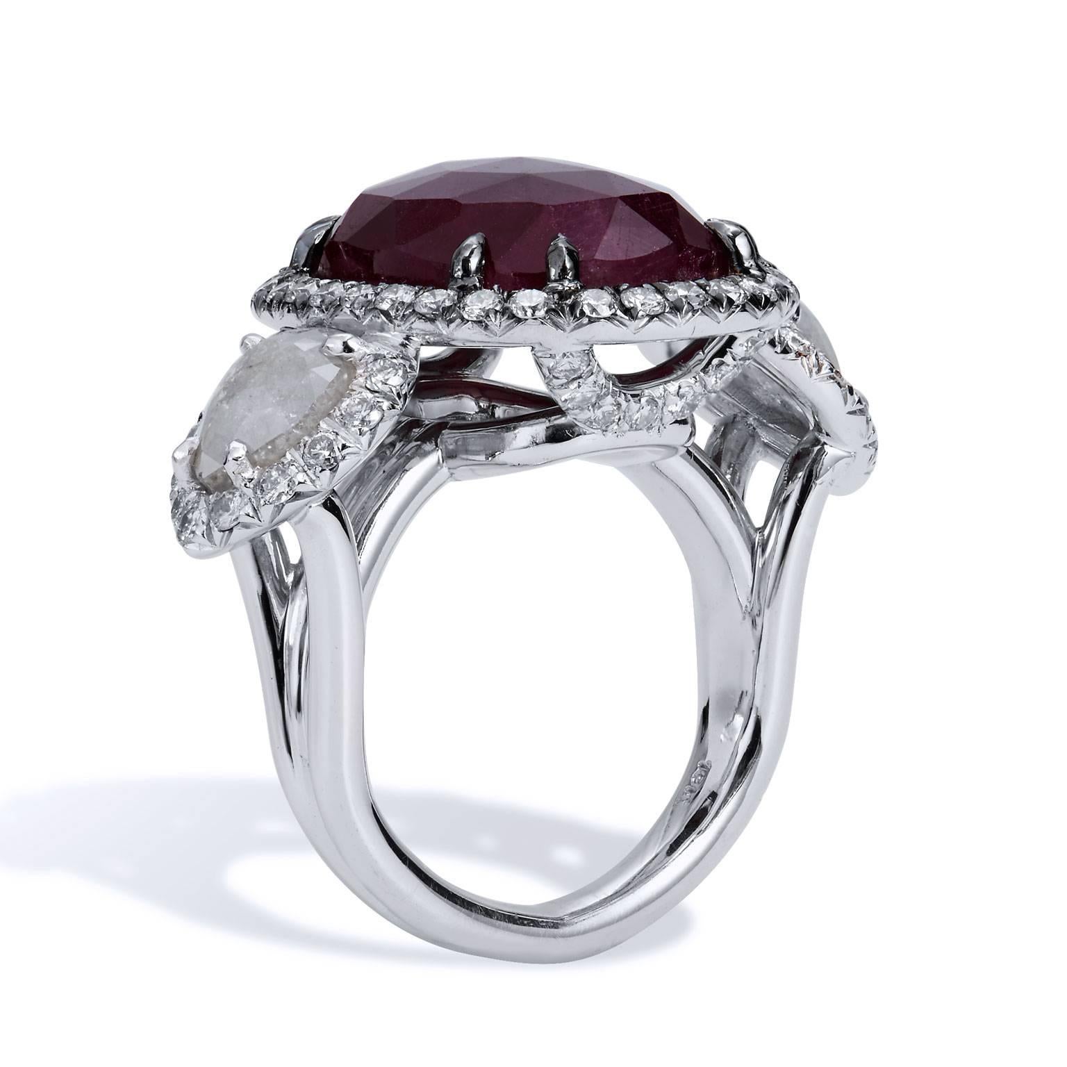 18.00 Carat Rose Cut Ruby and Diamond Slice 18 kt White Gold Cocktail Ring

Hues of deep red emit warmth and romance from the 18.00 carat ruby, as two rose cut diamond slices affixed at the shoulder glisten with pristine beauty. Handmade by H&H, the