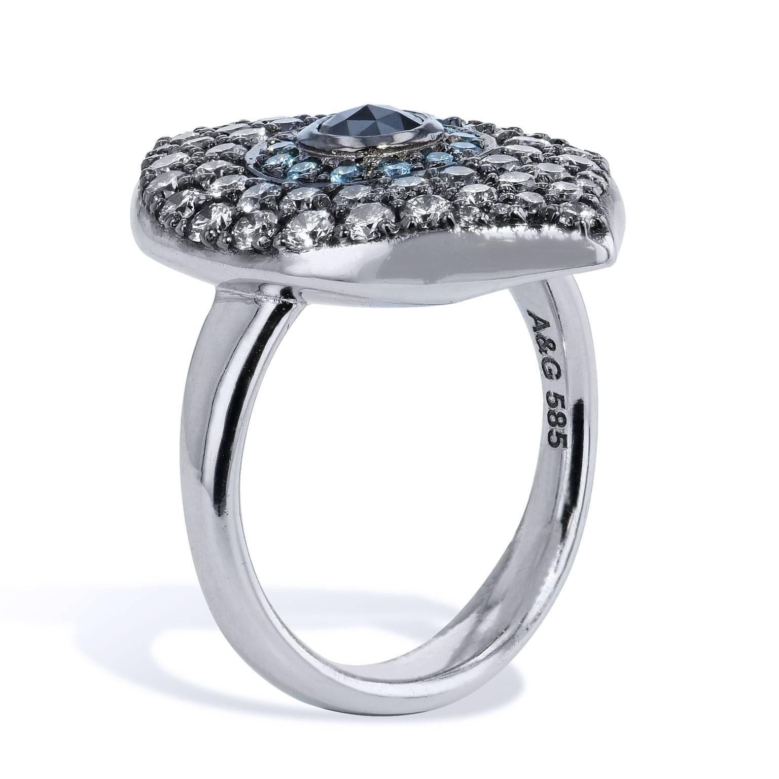 1.45 carat of pave-set diamond, affixed in 14 karat white gold and black rhodium-plated, come together to form the outline for this striking evil eye ring. 0.28 carat of black diamond is set at center and embraced by 0.19 carat of blue diamond,