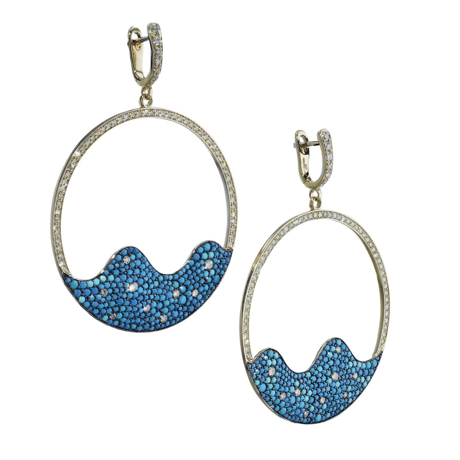 Get lost in a sea of pave-set crushed turquoise and diamonds in these 14 karat yellow gold hoop earrings. Featuring 2.26 carat of turquoise and pave diamonds adoring the hoop and bail, these earrings are a liquid dream. 