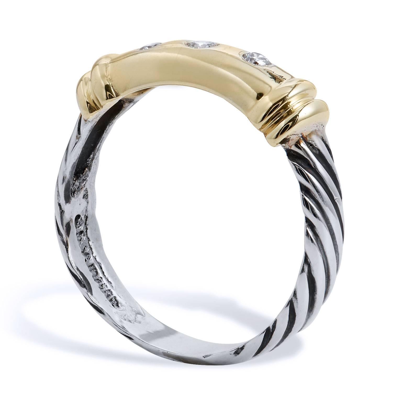 Enjoy this previously loved David Yurman Metro Collection 14 karat yellow gold and silver ring featuring three diamonds in flush setting.