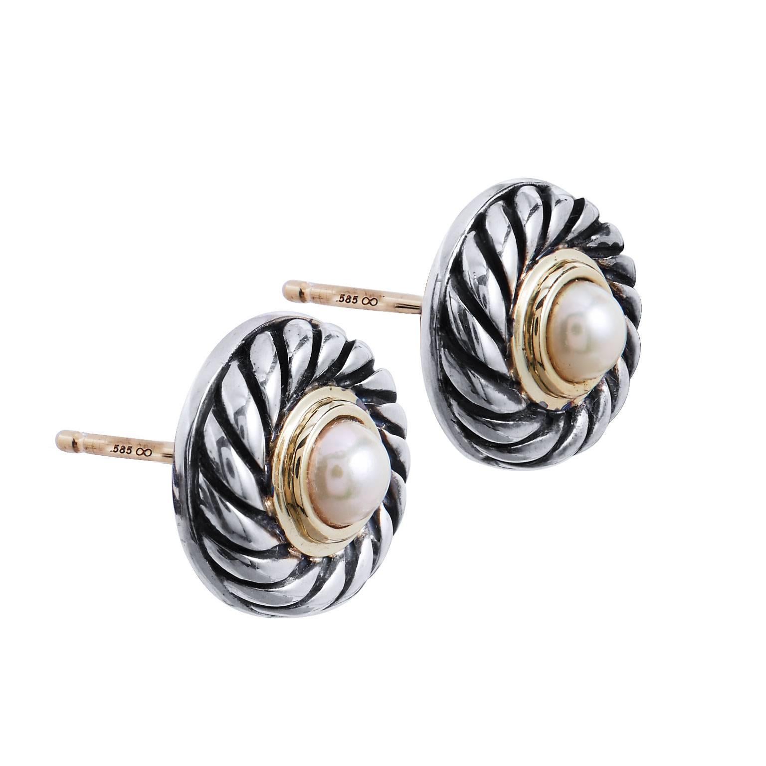 Enjoy these previously loved David Yurman Pearl Cookie stud earrings in 14 karat yellow gold and silver featuring 12 millimeter half pearls bezel set.