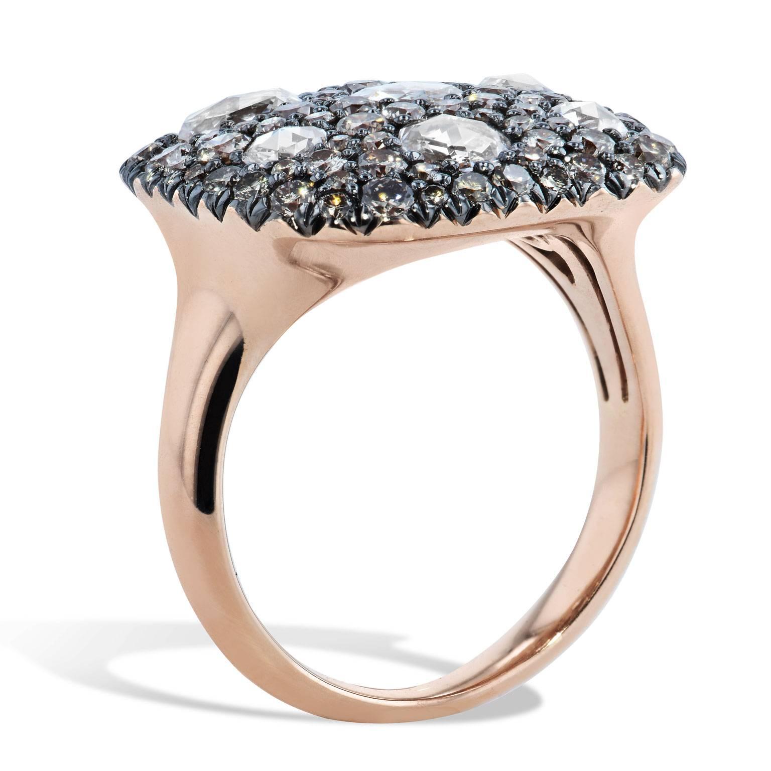 1.05 carat of round brilliant cut champagne diamonds and 1.13 carat of rose cut diamonds meld in a beautiful arrangement on cushion shape with rhodium prongs in this 18 karat rose gold fashion ring.
Size 6.5
Complementary sizing upon request