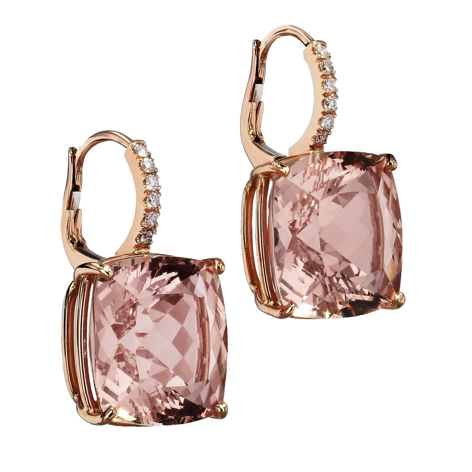 An original H and H design, these handcrafted 18 karat rose gold earrings feature 21.58 carat of morganite. Cushion cut morganite are prong set with twelve pieces of round diamonds pave set down the bail with a total weight of 0.13 carat (G/H/SI1).