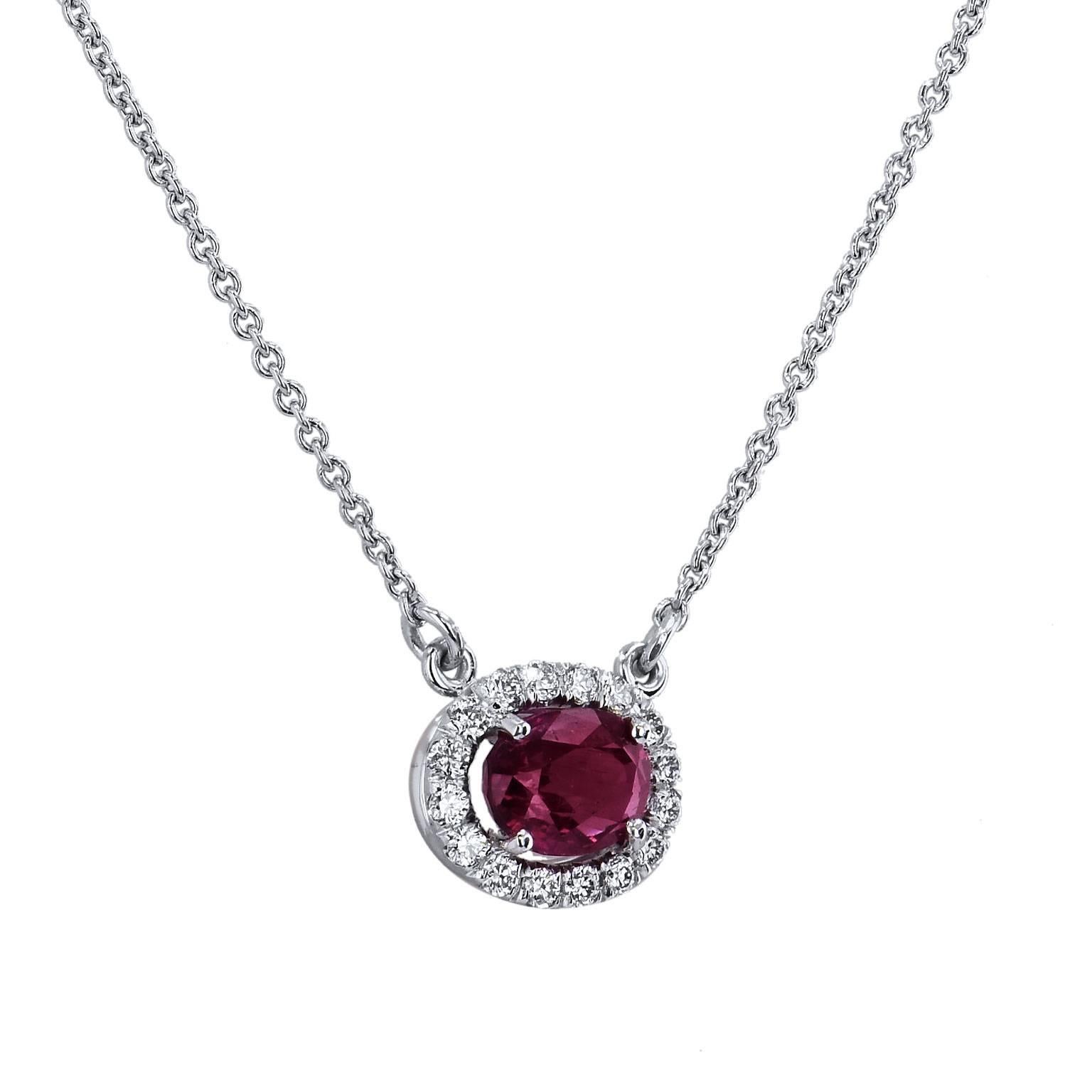 1.05 Carat Oval Thai Ruby & Diamond Halo Pendant 18 karat White Gold Necklace

Let the ruby's femininity and grace enrapture you in this handcrafted 18 karat white gold pendant necklace. 
A 1.05 carat oval Thai ruby is set at center and embraced by