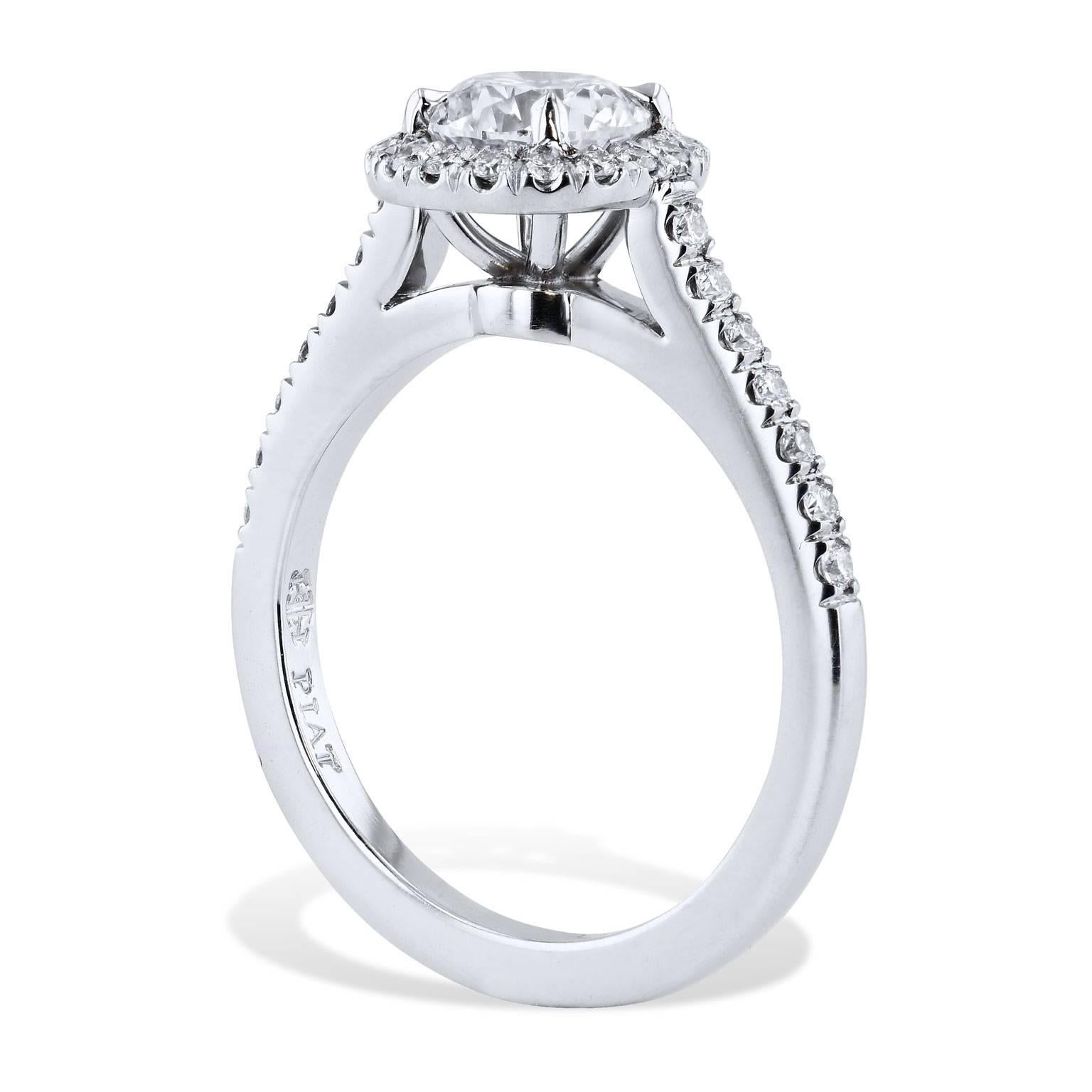GIA Certified Handmade 1.00 Carat Round Diamond Halo Engagement Ring

This platinum engagement ring features a 1.00 carat round prong-set diamond (H/VS2; GIA# 2185686724) at center. 0.13 carat of round diamonds are pave-set in halo surrounding the