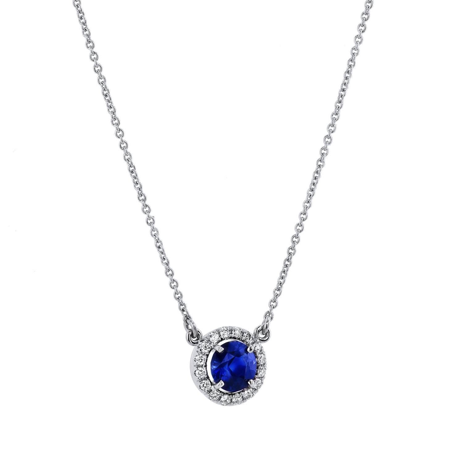 Let the sapphire’s tranquil blue hue sweep you away in this handcrafted 18 karat white gold pendant necklace. A 1.00 carat Madagascar blue sapphire is set at center and embraced by 0.12 carat of pave set diamond in halo (G/H/VS). Strung on an 18