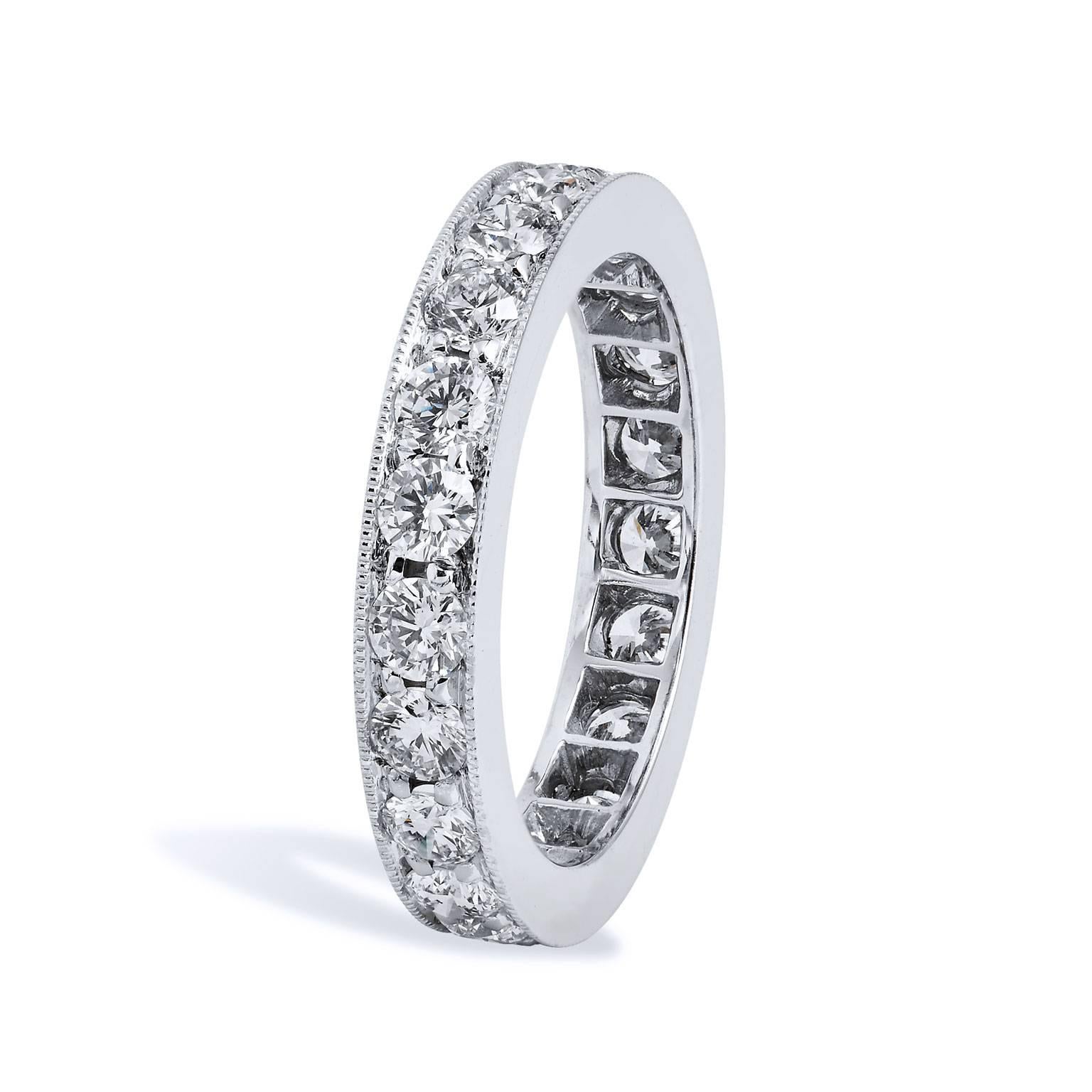 This handmade diamond band ring features twenty-one pieces of diamond pave set with a total weight of 1.70 carat (D/E/F/VS1). Affixed to a 3.60 millimeter 18 karat white gold band with milgrain work opens the eye, and allow the ring to pop with