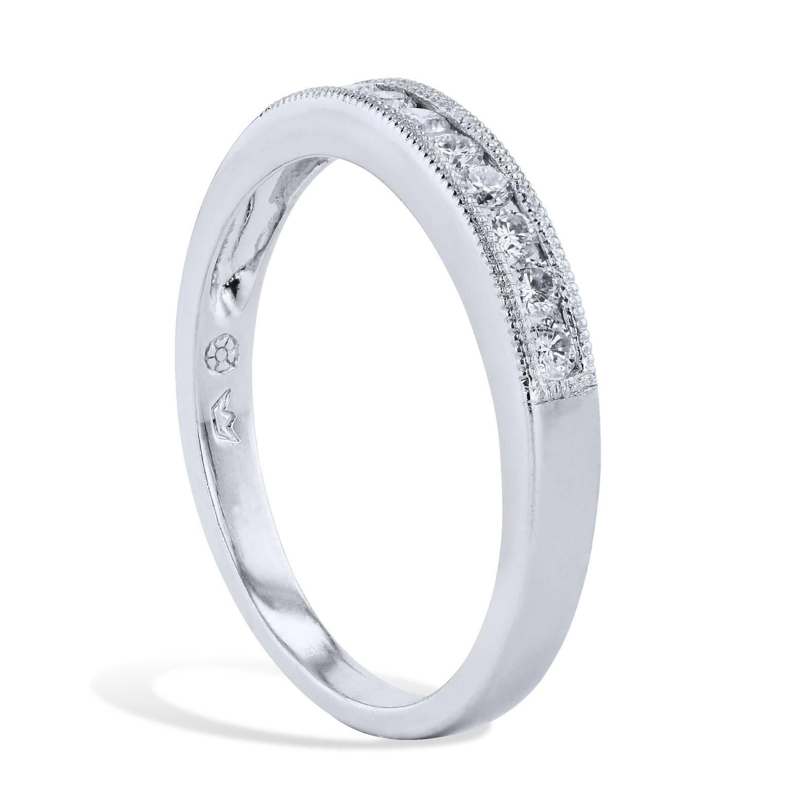 Estate 0.30 Carat Channel Set Diamond Band Platinum Ring

Enjoy this previously loved platinum diamond band ring featuring nine diamonds with milgrain work, 
channel-set with a total weight of 0.30 carat (F/G /SI1).  

This estate ring is in