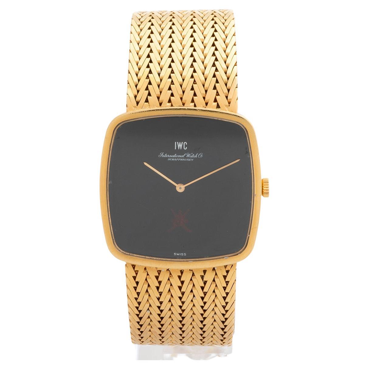 IWC Schaffhausen Oman Khanjar Wristwatch. Yellow Gold, Onyx Dial, Year 1972.