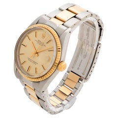 Reloj de pulsera Rolex Datejust 1600. Bisel estriado de oro amarillo, esfera de champán, 1972