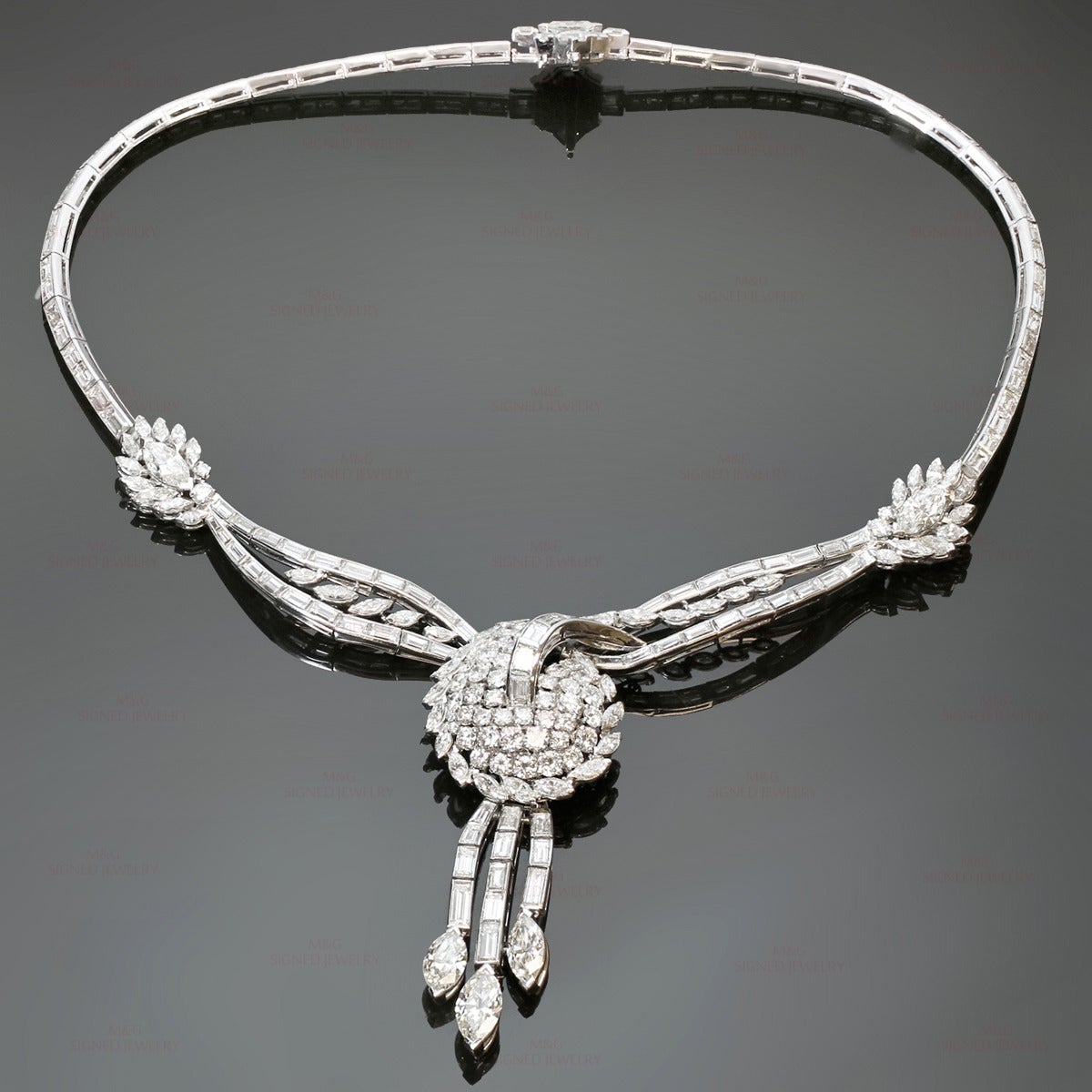 This gorgeous vintage evening necklace features a classic fringe design with a detachable pendant. Beautifully crafted in fine platinum and set with sparkling marquise-cut, square-cut, and baguette-cut diamonds of an estimated 38.75 carats. The