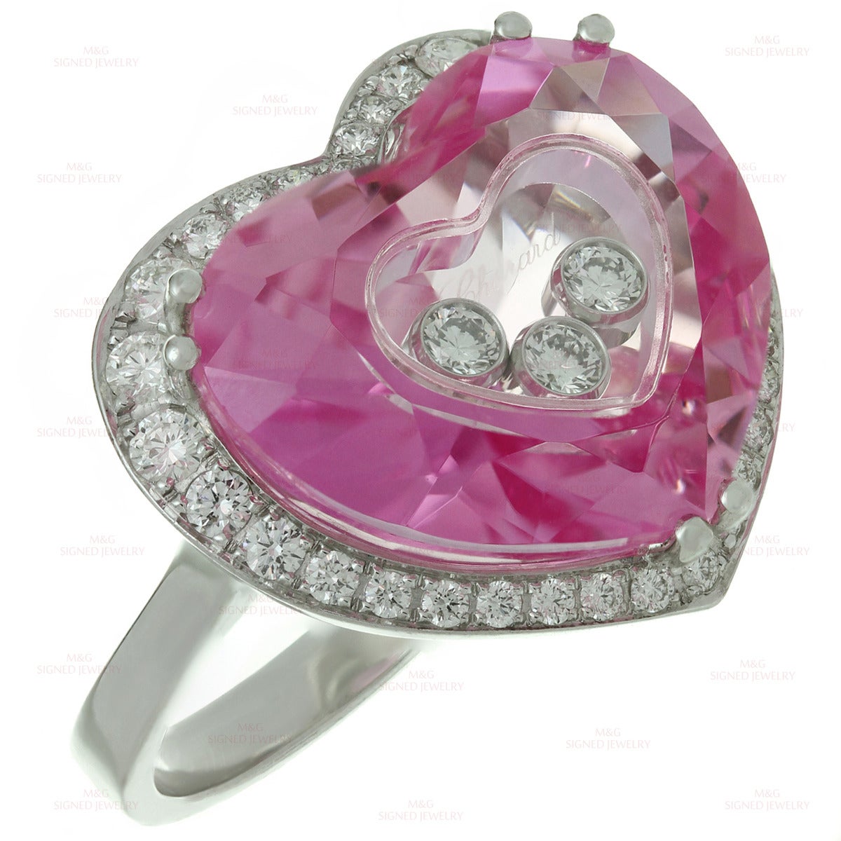 This romantic Chopard ring from the Happy Diamonds collection is made in 18k white gold and features a bright sparkling faceted heart-shaped pink quartz beautifully accented with 3 free-floating bezel-set F-G VVS2-VS1 diamonds and pave- set diamonds