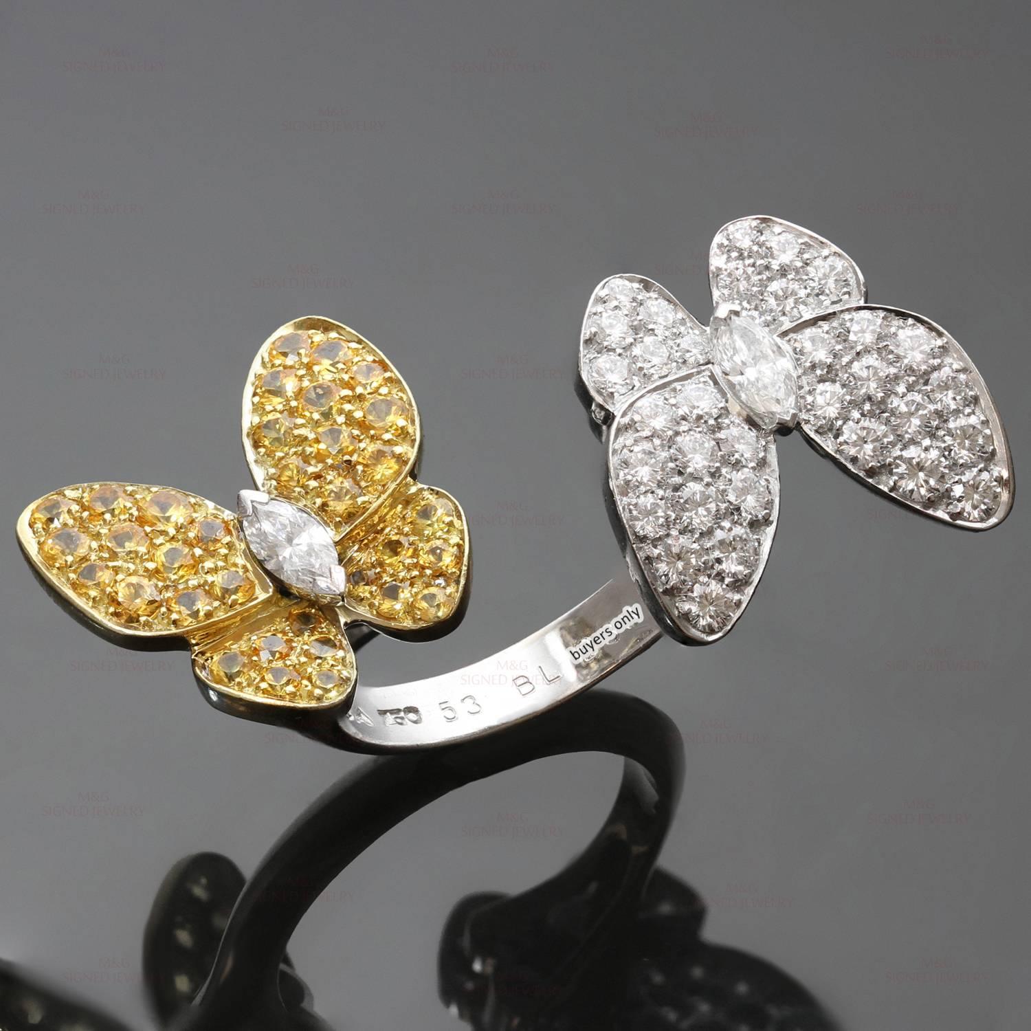 This fabulous Between the Finger ring from Van Cleef & Arpel's Two Butterfly collection is made in 18k white and yellow gold and features a pair of sparkling delicate butterflies fitting perfectly between two fingers in a striking contrast of