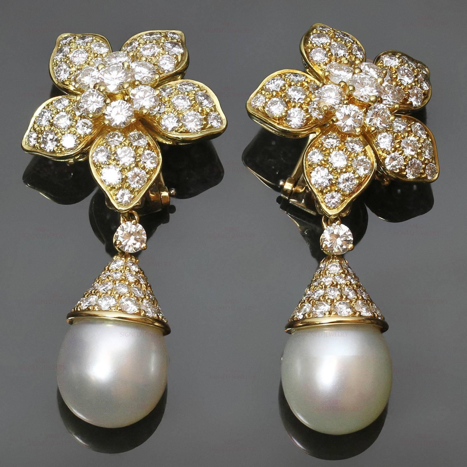 These magnificent Van Cleef & Arpels earrings are made in 18k yellow gold and feature a floral clip-on design set with sparkling round brilliant-cut E-G VVS diamonds of an estimated 7.0 carats and completed with elegant detachable South Sea