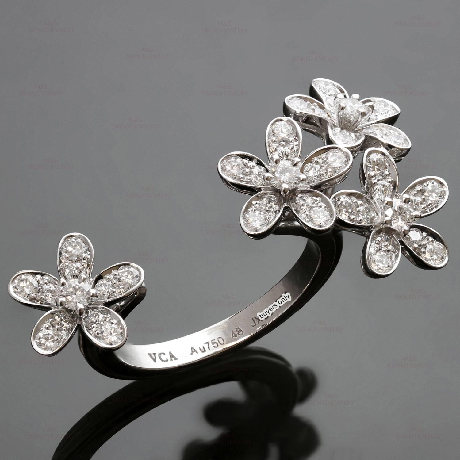 This iconic Between the Finger ring from Van Cleef & Arpel's Socrate collection is made in 18k white gold and features sparkling delicate flowers set with brilliant-cut round diamonds of an estimated 0.70 carats and fitting perfectly between two