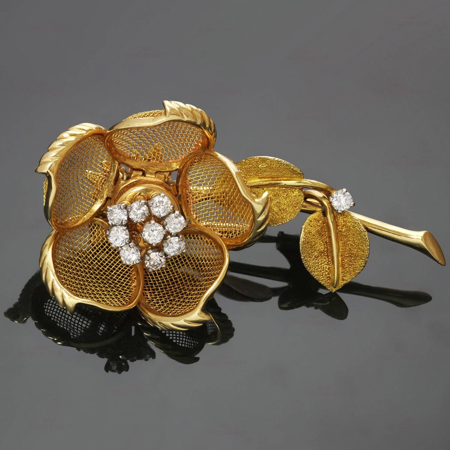 This stunning Cartier brooch features a rose flower design crafted in 18k yellow gold and set with brilliant-cut round diamonds of an estimated 0.70 - 0.80 carats. The petals on this brooch are movable. Made in France circa 1940s. Measurements: