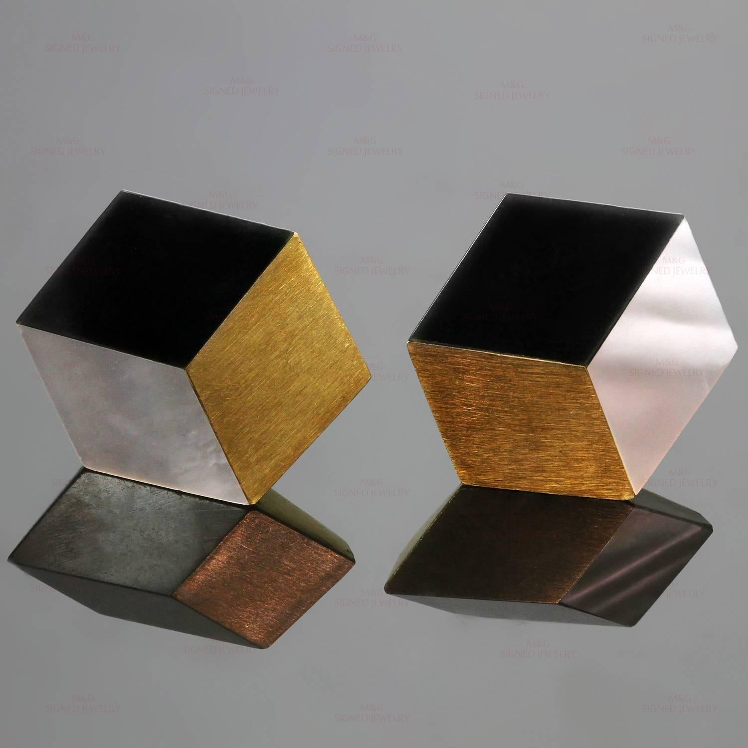 These rare and spectacular Angela Cummings earrings feature a chic cube design crafted in 18k yellow gold and accented with black onyx and mother-of-pearl. Made in United States circa 1980s. Measurements: 0.90