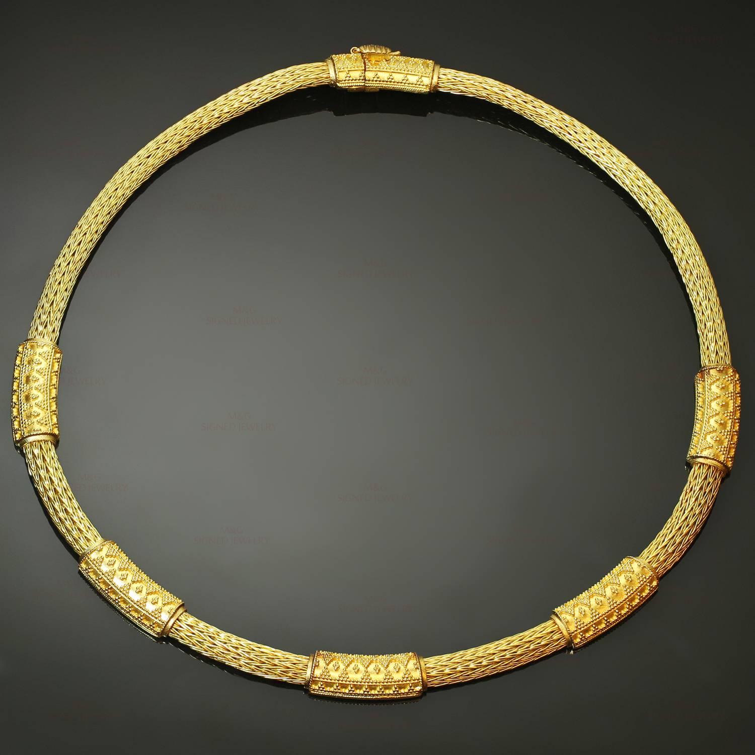 This classic Ilias Lalaounis necklace is crafted in 18k yellow gold and features a flexible mesh wheat link chain design accented with textured geometric elements. Made in Greece circa 1980s. Measurements: 0.23" (6mm) width, 17.5" (44.4cm)