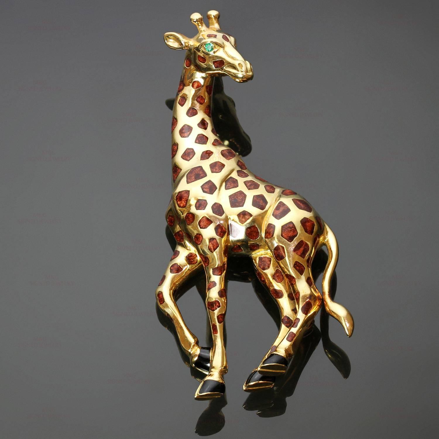 This fabulous Cartier brooch features a chic giraffe design crafted in 18k yellow gold and accented with emerald and enamel. Made in France circa 1980s. Measurements: 1.33" (34mm) width, 2.87" (73mm) length. 