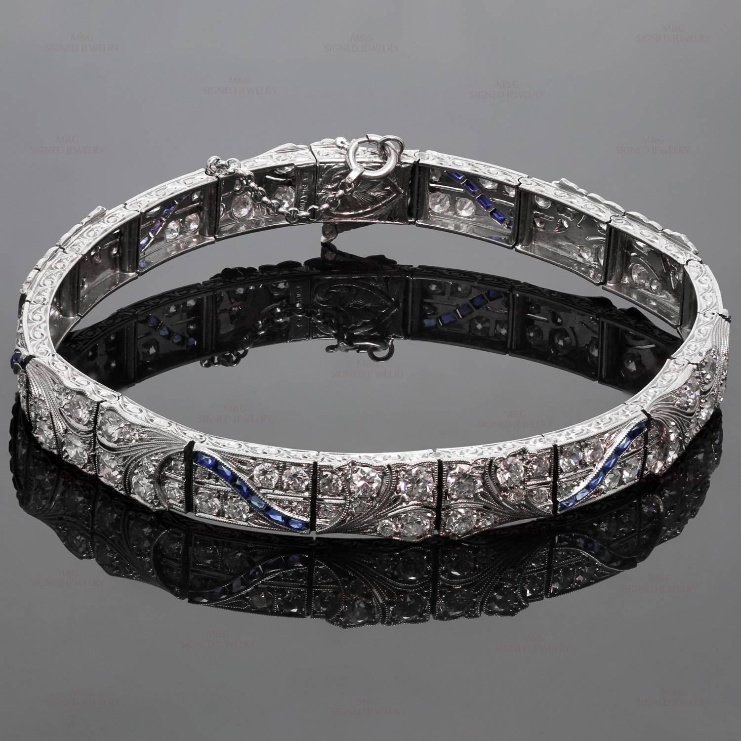 This fabulous art deco bracelet features intricate millegrain and scollwork crafted in platinum and accented with 120 old European and old mine cut diamonds of an estimated 6.80 carats and 36 channel set French-cut blue sapphires. There is no damage
