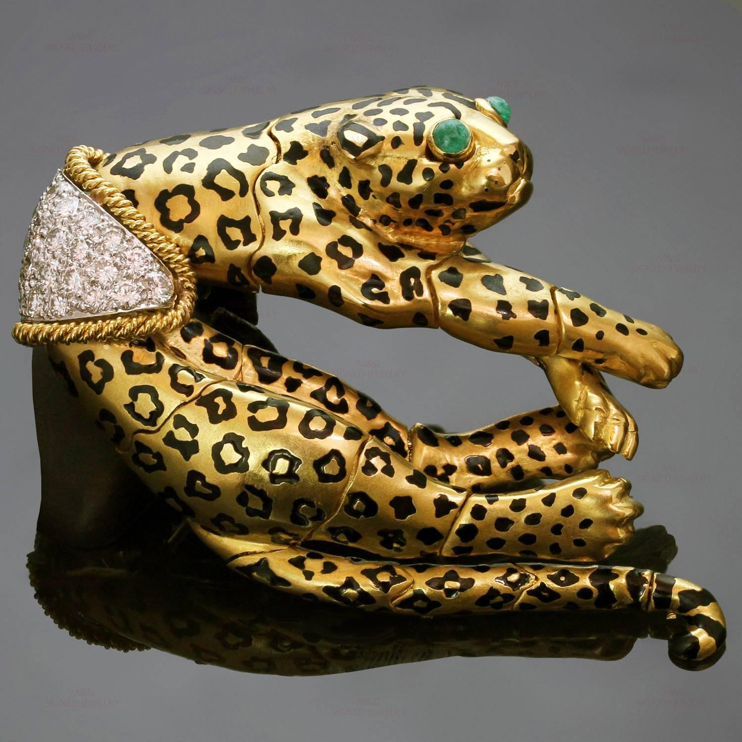 This vintage David Webb brooch features a gorgeous leopard design intricately articulated for realistic movement. The brooch is crafted in 18k yellow gold and accented with cabochon emerald eyes, black enamel spots, and brilliant-cut round diamonds