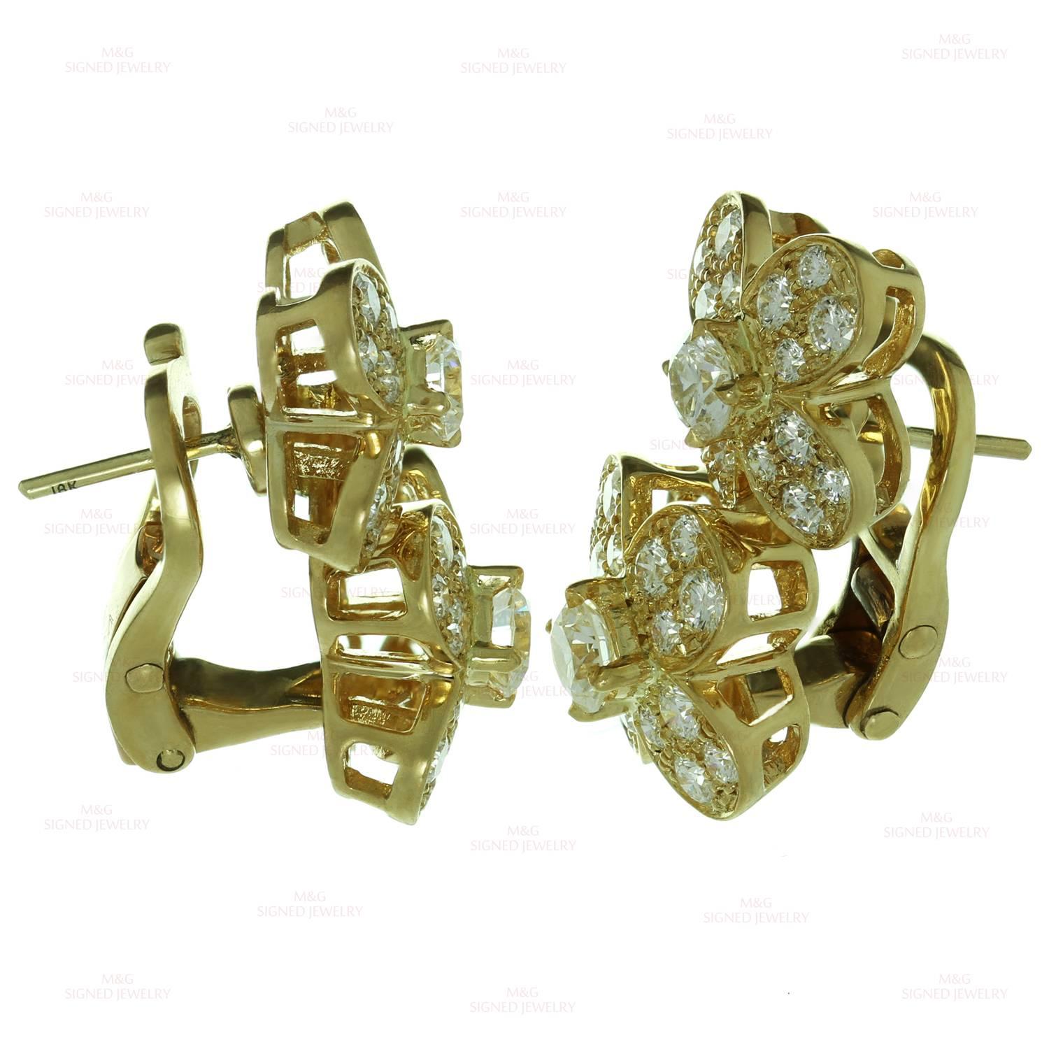 These exquisite Van Cleef & Arpels earrings from the classic Trefle collection feature a 2-flower design crafted in 18k yellow gold and accented with brilliant-cut round diamonds. Made in France circa 2000s. Measurements: 0.47