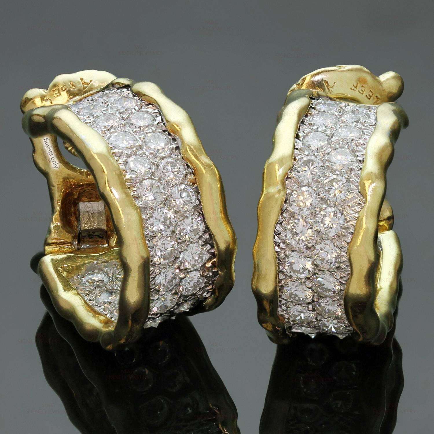 These magnificent Van Cleef & Arpels earrings feature a classic wrap design crafted in 18k yellow gold and set with brilliant-cut round diamonds of an estimated 4.50 carats. Made in France circa 1990s. Measurements: 0.43" (11mm) width,