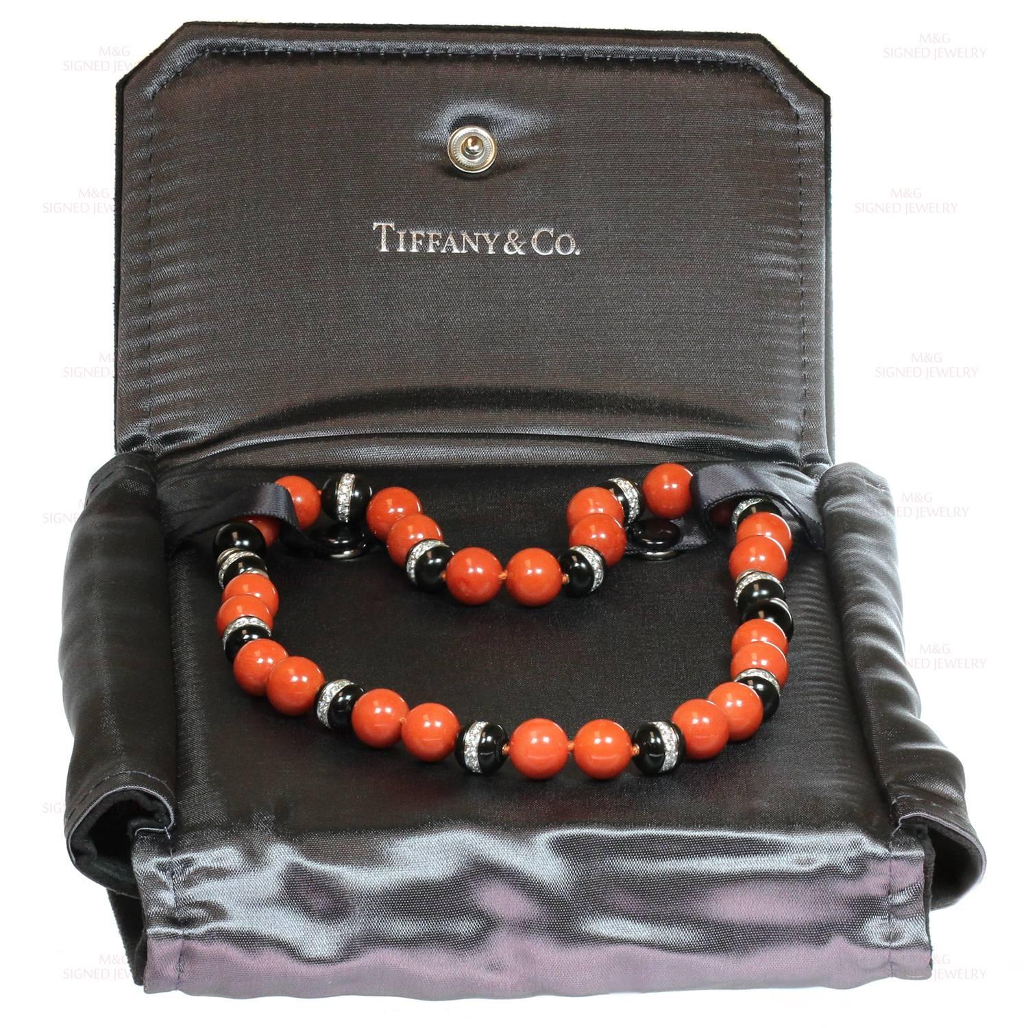 This fabulous pair of platinum Tiffany bracelets feature red oxblood coral beads alternating with black onyx beads accented with briliant-cut round diamonds of an estimated 4.75 carats. These versatile bracelets can be converted into a necklace.