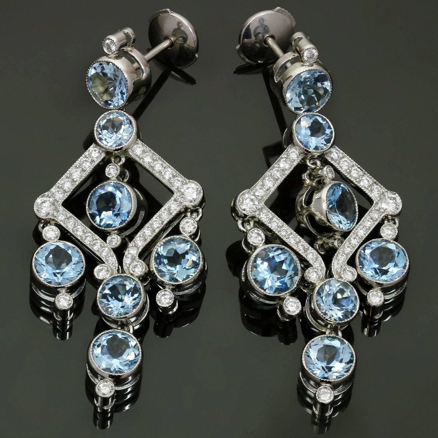 These magnificent Tiffany earrings are crafted in platinum and beautifully set with 14 round intense blue sparkling aqumarine stones measuring  4.0mm to 5.0mm and weighing an estimated 5.50 carats and 70 brilliant-cut round G/VS diamonds measuring