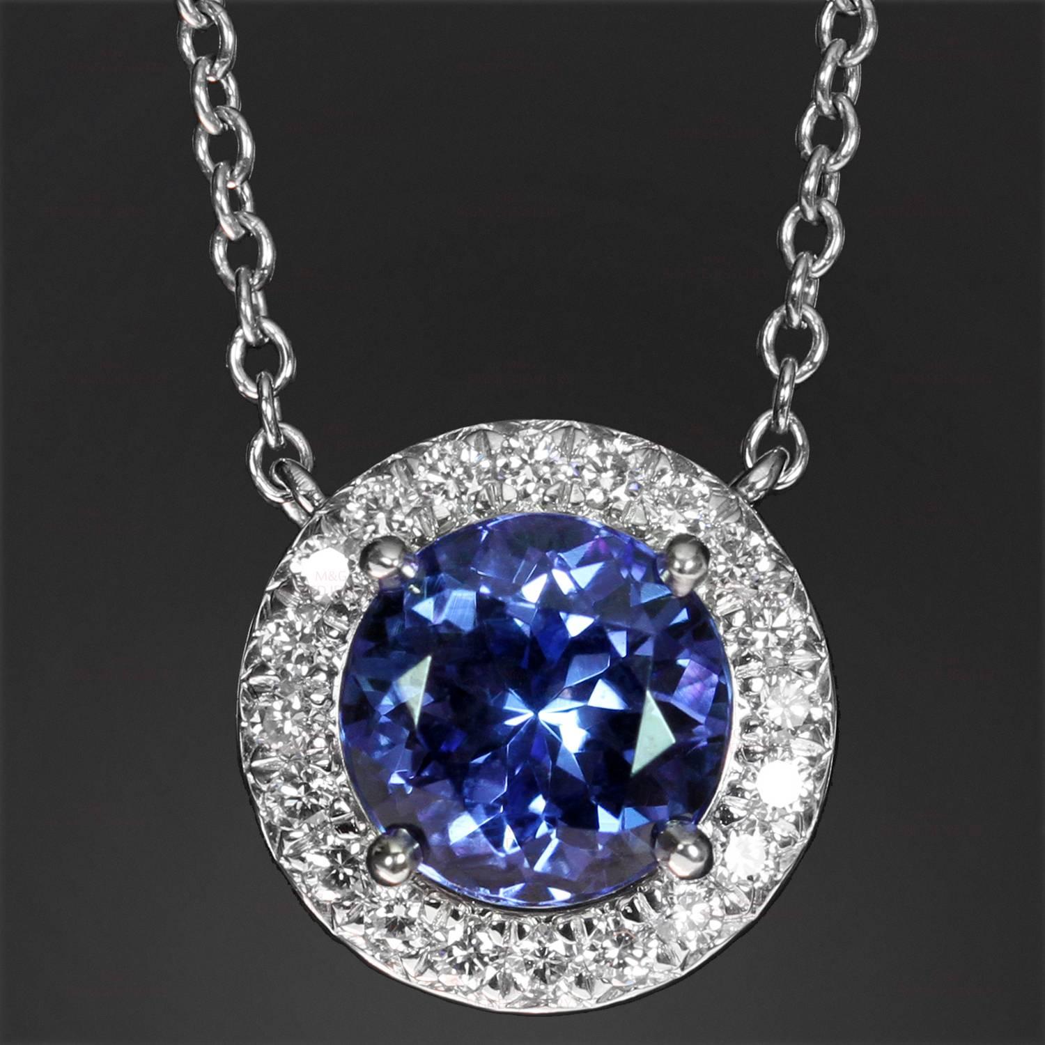This stunning necklace from Tiffany's Seleste collection is crafted in platinum and features a round pendant set with a dazzling tanzanite of an estimated 0.70 carats surrounded by brilliant-cut round diamonds of an estimated 0.10 carats. Made in