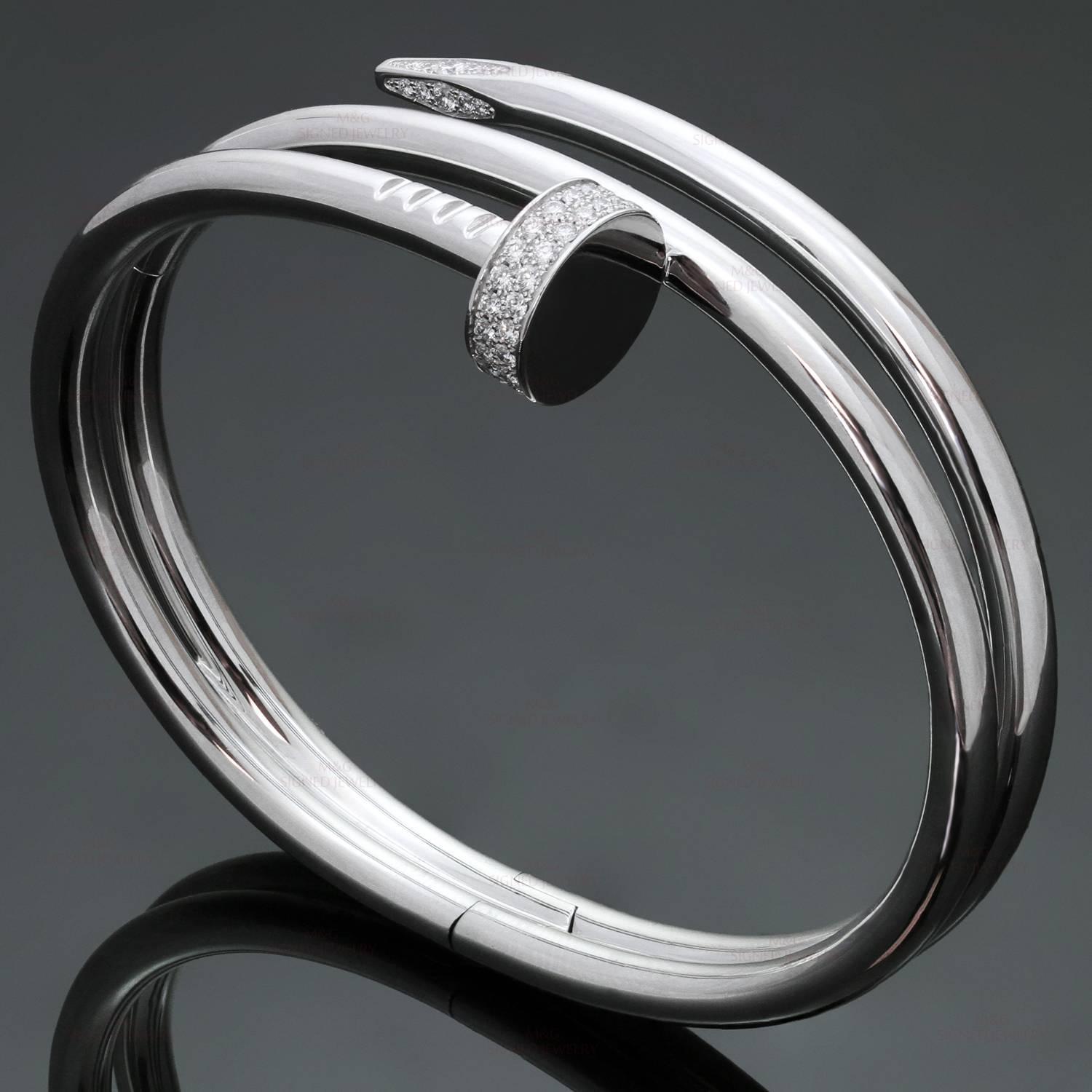 This chic and rare hinged double-row bangle from Cartier's Juste Un Clou collection is crafted in 18 white gold and set with 62 sparkling round brilliant-cut diamonds of an estimated 0.51 carats. This rare bracelet is a size 15. Comes with Cartier