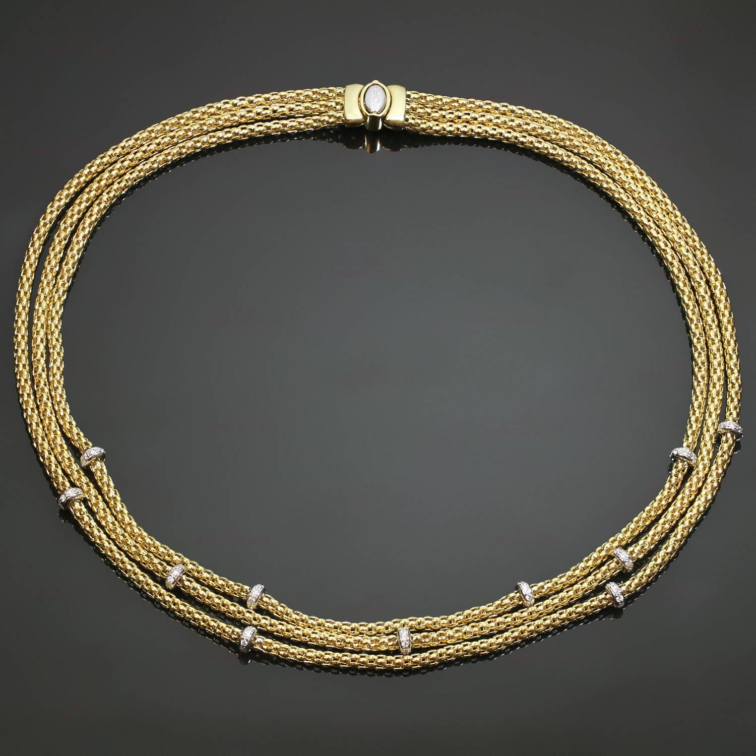 This classic mesh necklace by fine Italian maker Fope Giolle features an interconnected 3-row design crafted in 18k yellow gold and accented with brilliant-cut round diamonds of an estimated 0.88 carats set in 18k white gold. Made in Italy circa