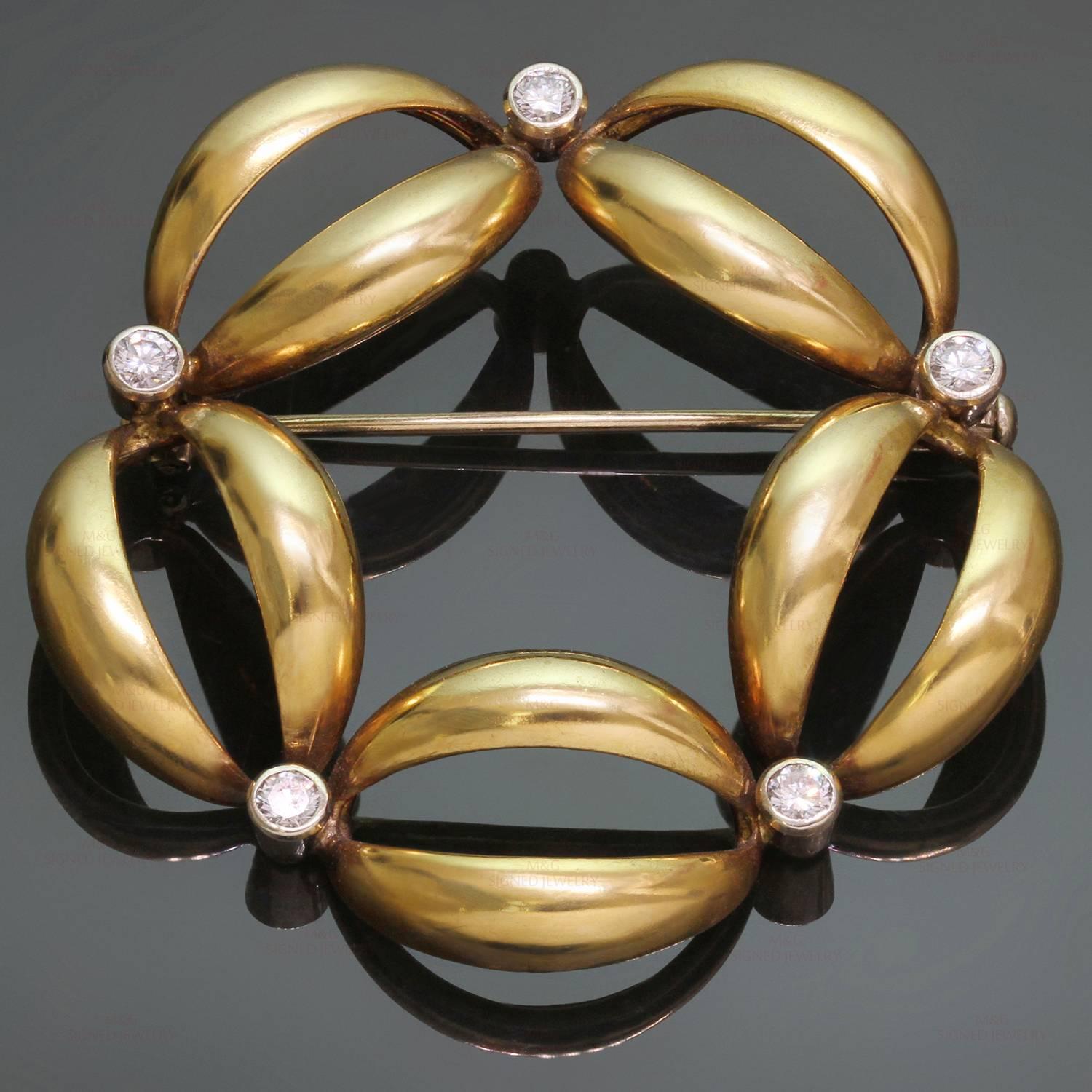 This classic brooch is crafted in 18k yellow gold and accented with round brilliant-cut diamonds of an estimated 0.52 carats bezel-set in 18k white gold. Made in United States circa 1980s. Measurements: 0.82" (21mm) width, 1.81" (46mm)