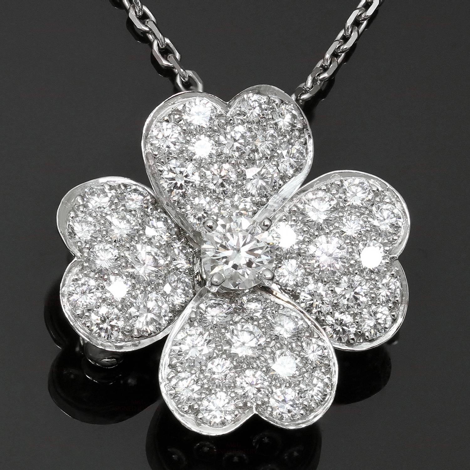 This stunning Van Cleef & Arpels necklace from the elegant Cosmos collection features a floral clip pendant with heart-shaped petals crafted in 18k white gold and set with 53 brilliant-cut round DEF, IF to VVS diamonds of an estimated 1.57