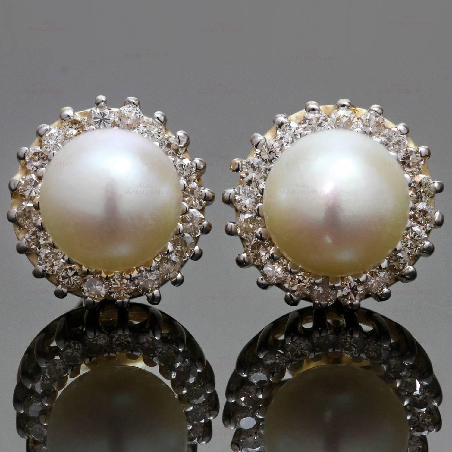 These elegant stud earrings are crafted in 14k yellow gold and set with freshwater cultured pearls measuring 7.5mm - 7.8mm and surrounded with round brilliant-cut diamonds of an estimated 0.80 carats. Made in United States circa 2010s. Measurements: