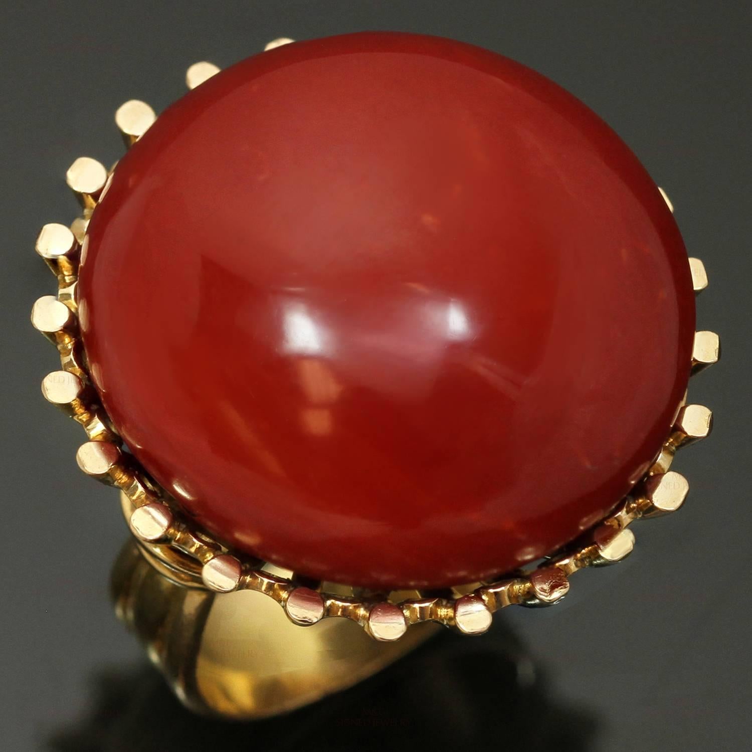 This rare and fabulous ring is hand-crafted in 18k yellow gold and set with a 25.0mm round natural deep red oxblood coral. Made in Italy circa 1950s. Measurements: 1.10