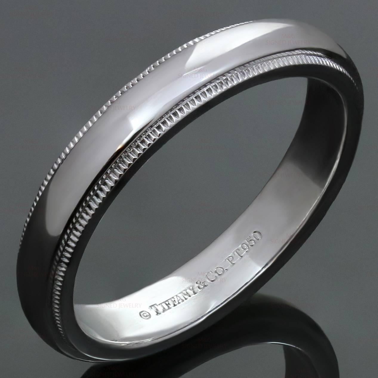 This classic men's Tiffany wedding band ring features a classic milgrain design crafted in platinum. Made in United States circa 2010s. Measurements: 0.15
