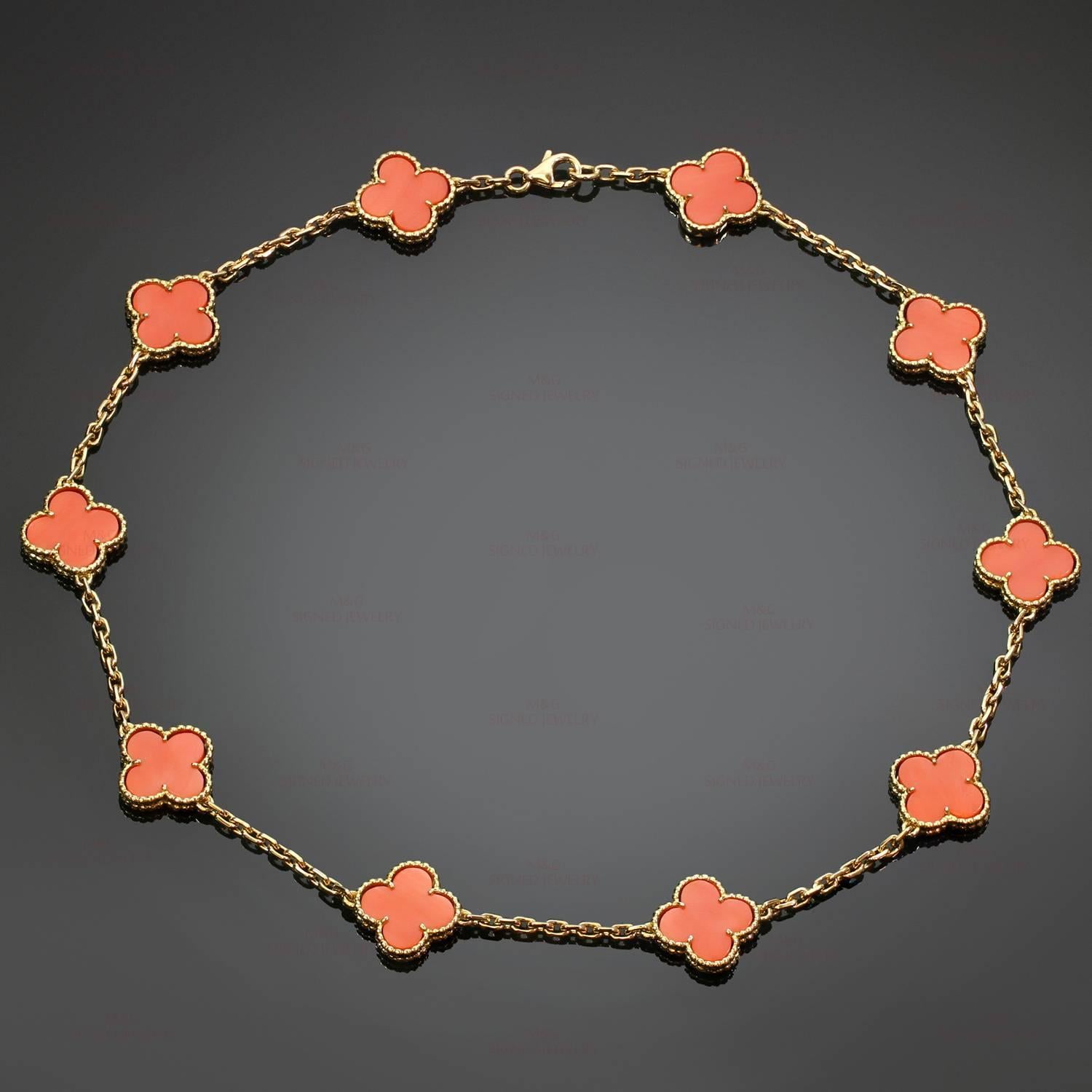 This rare out-of-production Van Cleef & Arpels necklace is crafted in 18k yellow gold and features 10 lucky clover motifs beautifully inlaid with coral in round bead settings. Made in France circa 1990s. Measurements: 0.59