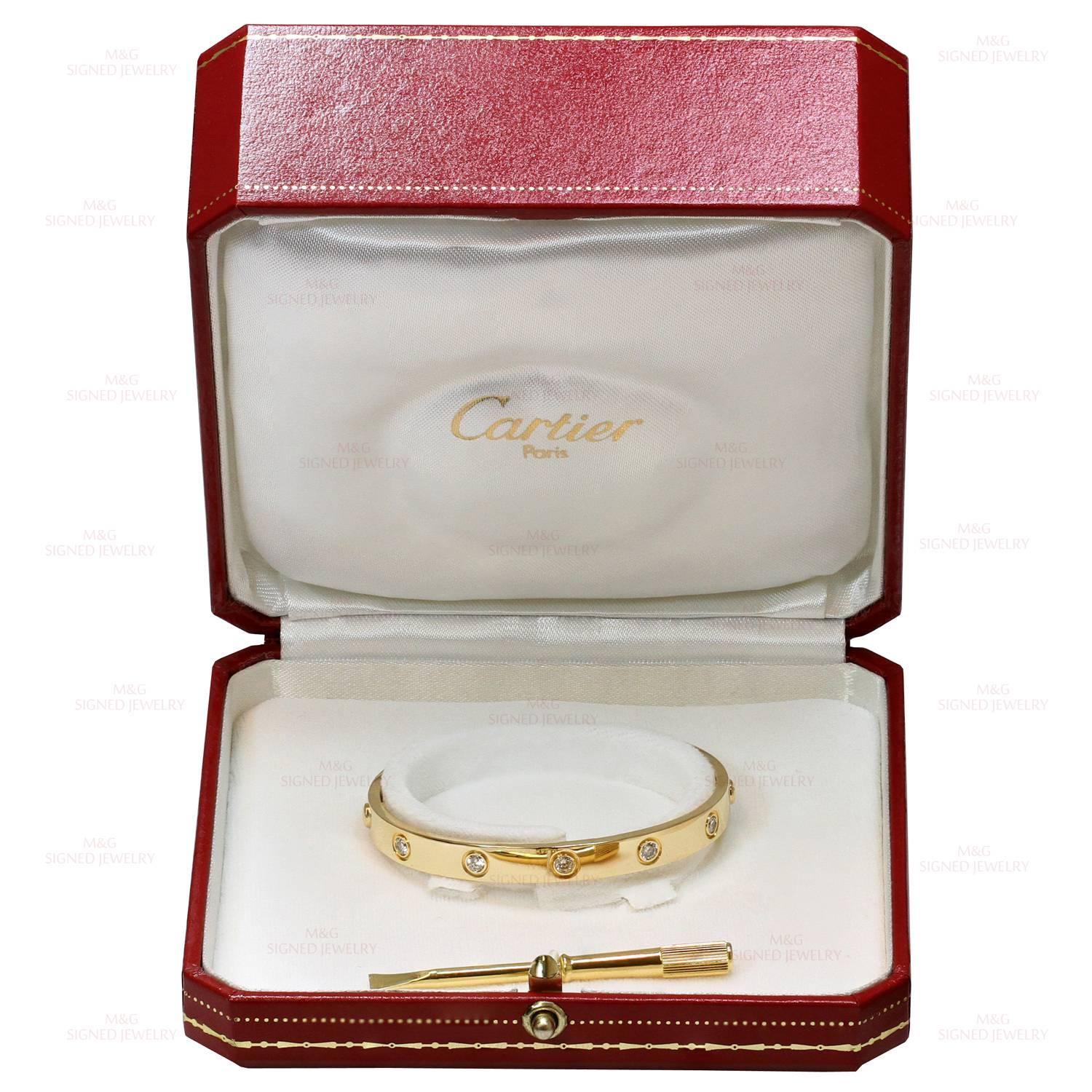 This iconic and timeless bracelet from Cartier's Love collection is finely crafted in 18k yellow gold and set with 10 brilliant-cut round diamonds. Completed with the original Cartier screwdriver, box, and papers. This bangle is a size 16. Made in