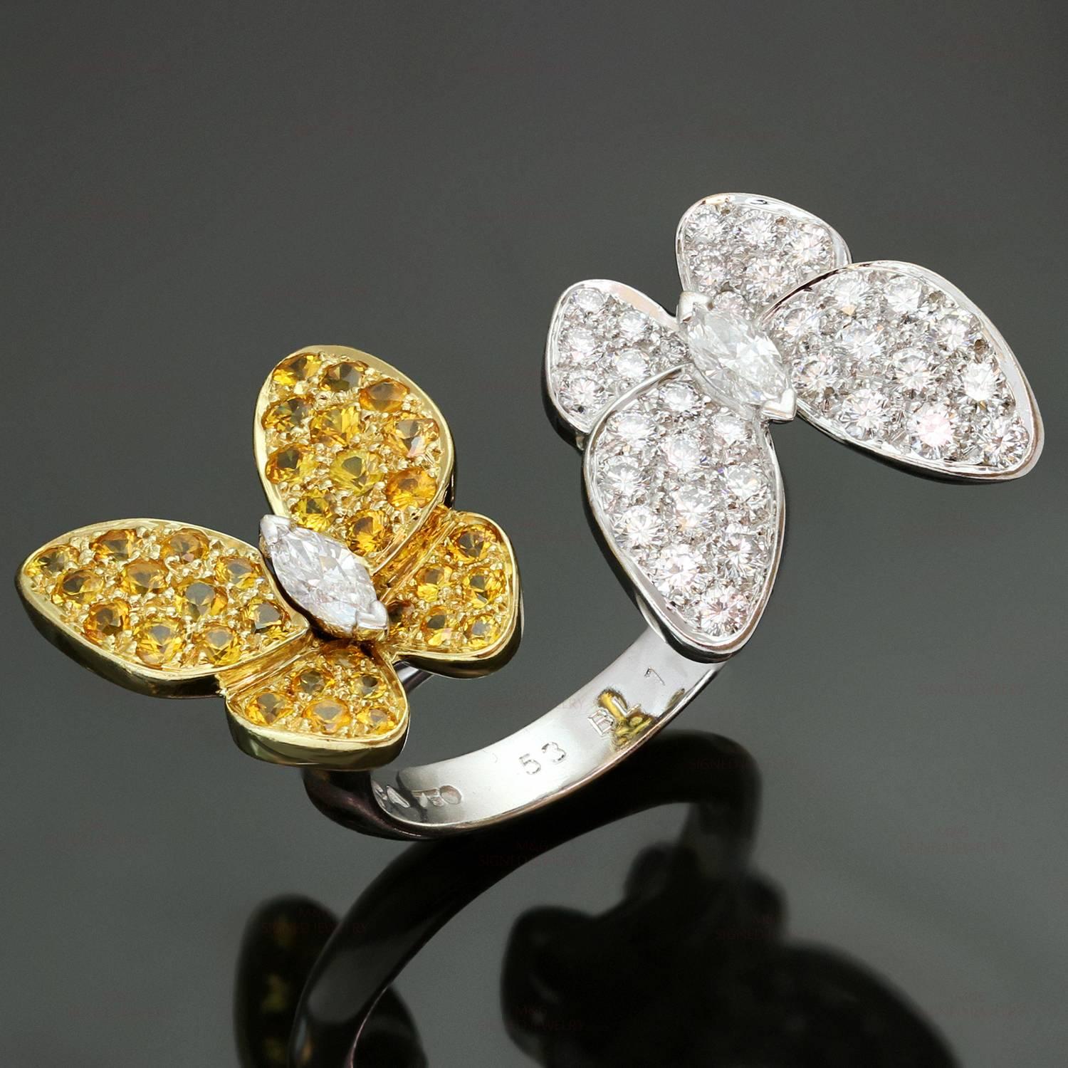 This dazzling Between the Finger ring from Van Cleef & Arpel's Two Butterfly collection is made in 18k white and yellow gold and features a pair of sparkling delicate butterflies fitting perfectly between two fingers in a striking contrast of