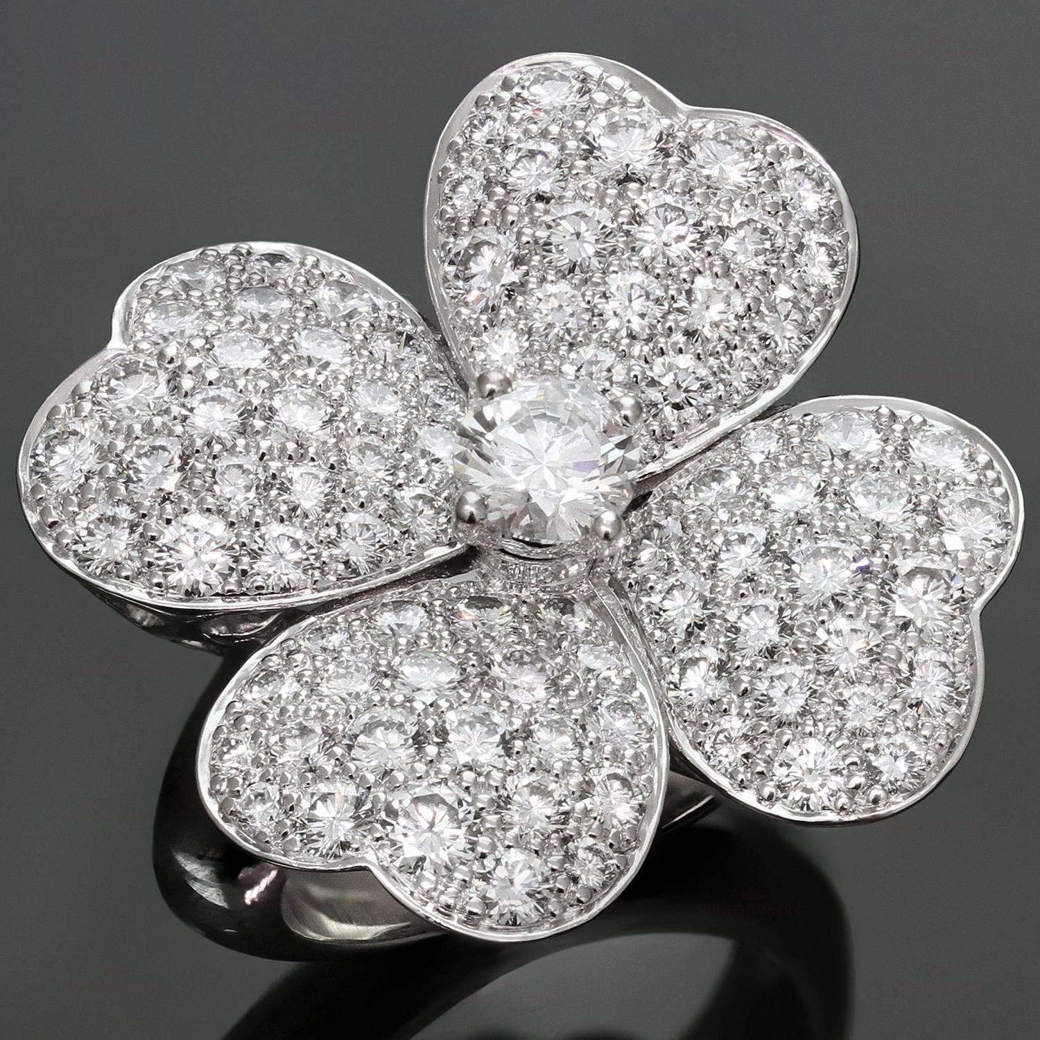 This magnificent Van Cleef & Arpels ring from the elegant Cosmos collection features a 4-petal flower motif crafted in 18k white gold and set with brilliant-cut round diamonds of an estimated 3.25 carats. This is the large model of the ring made in